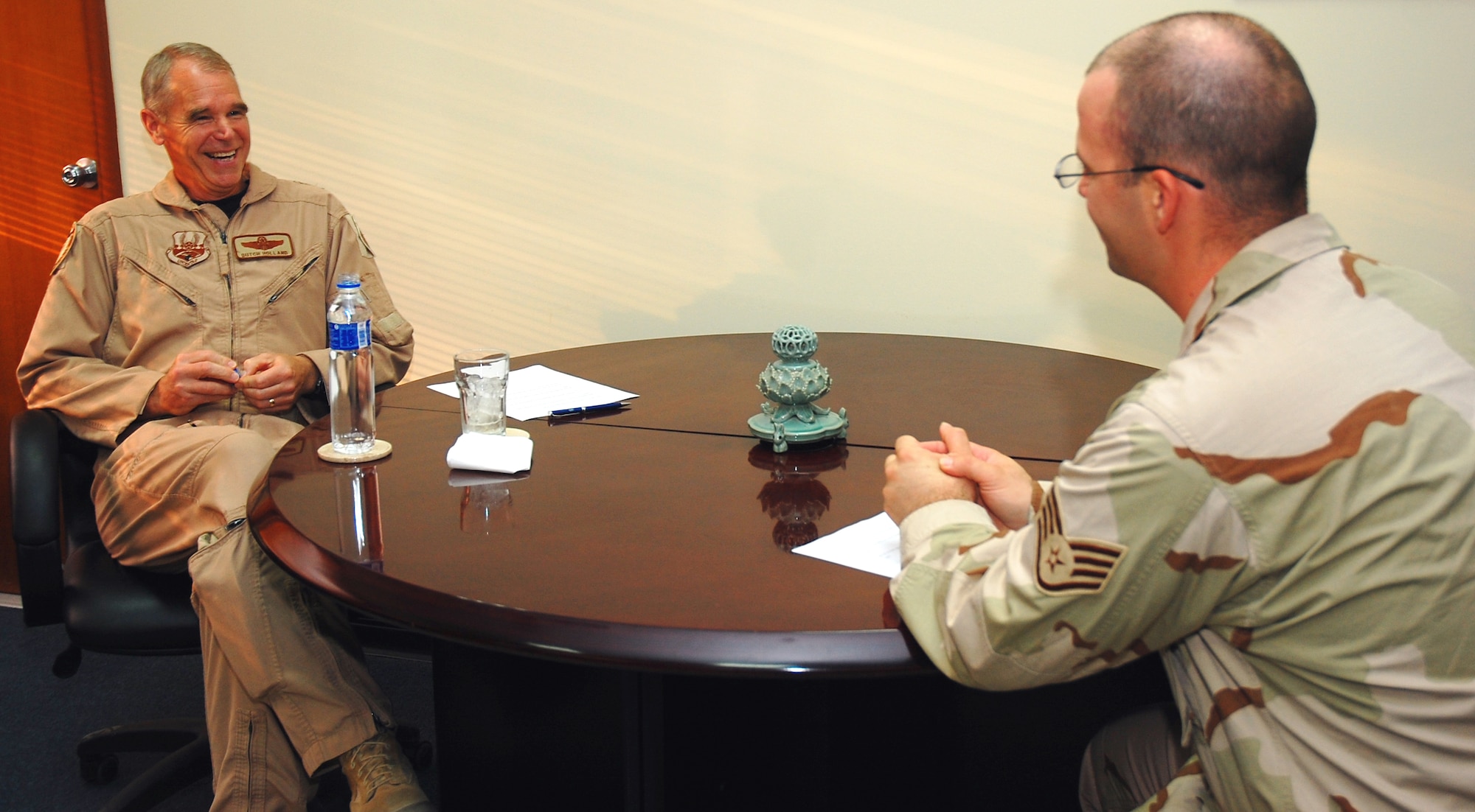 SOUTHWEST ASIA -- Staff Sgt. Phillip Butterfield, 386th Air Expeditionary Wing Public Affairs, interviews Maj. Gen. William "Dutch" Holland, Vice Commander, 9th Air Force and Deputy Commander, U.S. Central Command Air Forces, during General Holland's visit to an undisclosed location in Southwest Asia Sept 30.  Sergeant Butterfield is deployed from Luke Air Force Base, Ariz.  (U.S. Air Force photo by Staff Sgt.Tia Schroeder)