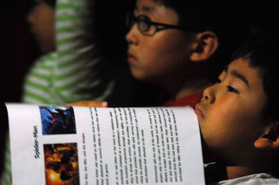 KUNSAN AIR BASE, South Korea - Korean kids listens to Colonel CQ Brown, 8th Fighter Wing Commander, as he read the book "I Can Move" during a storytelling session at the Gunsan City library Sept 29.  Col. Brown read several books during the reading session.  The reading program, a new initiative meant to help Korean kids learn English is part of the Good Neighbor Program, a program used to foster relations with the local community and Airmen assigned here.  (U.S. Air Force photo/ TSgt. Quinton T. Burris)   