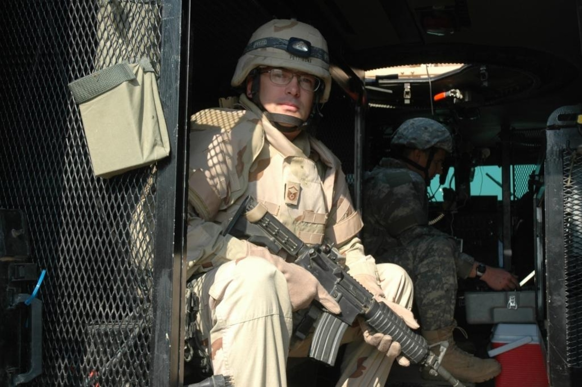 SPANGDAHELM AIR BASE, Germany – During his deployment to Iraq, Master Sgt. Ken Pettibone, 52nd Civil Engineer Squadron NCOIC of Explosive Ordnance Disposal Operations, sits in the back of a Joint EOD Rapid Response Vehicle while a robot operator disrupts an improvised explosive device. Sergeant Pettibone was deployed for one year to Iraq where he served at Forward Operation Base Kalsu, Camp Slayer and Camp Taji, Iraq. (Courtesy photo)
