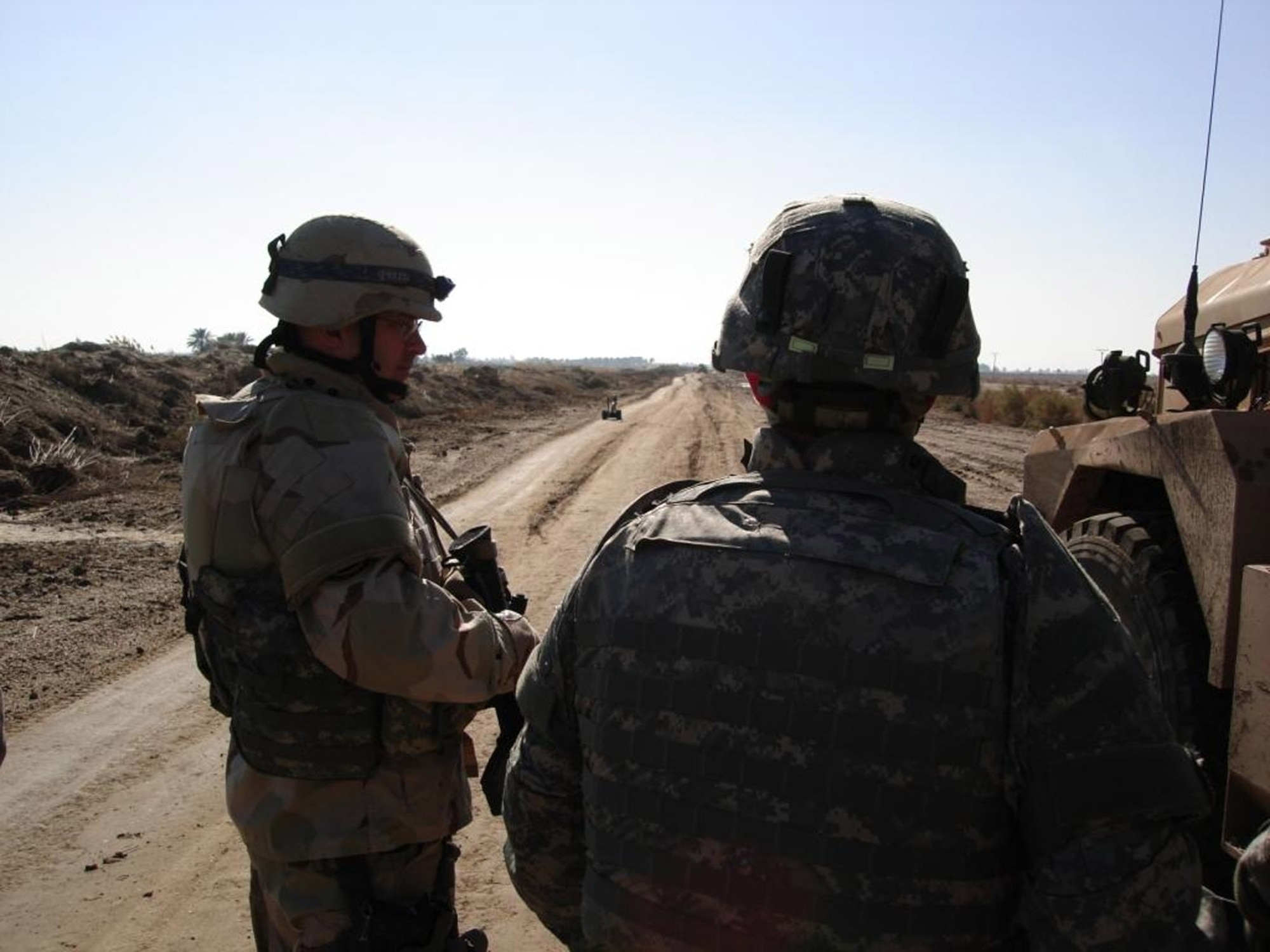 SPANGDAHELM AIR BASE, Germany – During his deployment to Iraq, Master Sgt. Ken Pettibone, 52nd Civil Engineer Squadron NCOIC of Explosive Ordnance Disposal Operations, talks to the EOD team chief about improvised explosive device components a Talon robot was bringing back to him from a Victim Operated IED, targeting Iraqi Army personnel in the area. Sergeant Pettibone was deployed for one year to Iraq where he served at Forward Operation Base Kalsu, Camp Slayer and Camp Taji, Iraq. (Courtesy photo)
