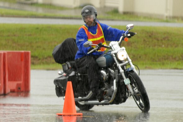 Troy McClain, a retired Marine, rides his motorcycle around a cone during the safety competition at the motorcycle all-call Sept. 21.
(U.S. Air Force photo/Airman 1st Class Kasey Zickmund)
