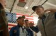 LANGLEY AIR FORCE BASE, Va. -- Gail Halvorsen (right) also known as the Candy Bomber for his service as a pilot during the Berlin Airlift , describes his previous missions to 2nd Lt. Georganne Schultz (left), 1st Fighter Wing Public Affairs, and fellow veterans Bill Morrissey and Bill Donahue. The veterans visited Langley during the annual Berlin Veterans Association reunion Oct. 1.  (U.S. Air Force photo/Airman 1st Class Vernon Young)