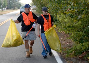 LANGLEY AIR FORCE BASE, Va. -- Retired Master Sgt. Mike Byrd, Air Combat Command Flight Operations and Training Branch analyst and Airman 1st Class Christopher Lancaster, 10th Intelligence Squadron network technician, pick up trash outside the King Street Gate Sept. 28. The cleanup was conducted by volunteers from the Air Force Sergeants Association as part of the Adopt-A-Spot program in Hampton. (U.S. Air Force photo/Tech. Sgt. Levi Collins)