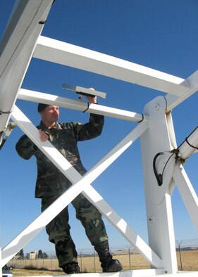 FAIRCHILD AIR FORCE BASE, Wash. – Tech. Segt. Dan Merrill, Fairchild NCO-in-charge of the Installation Security Constable program, checks the bars on the “Sky Watch” tower, a mobile surveillance tower, prior to positioning it. (U.S. Air Force photo/Shadi May)