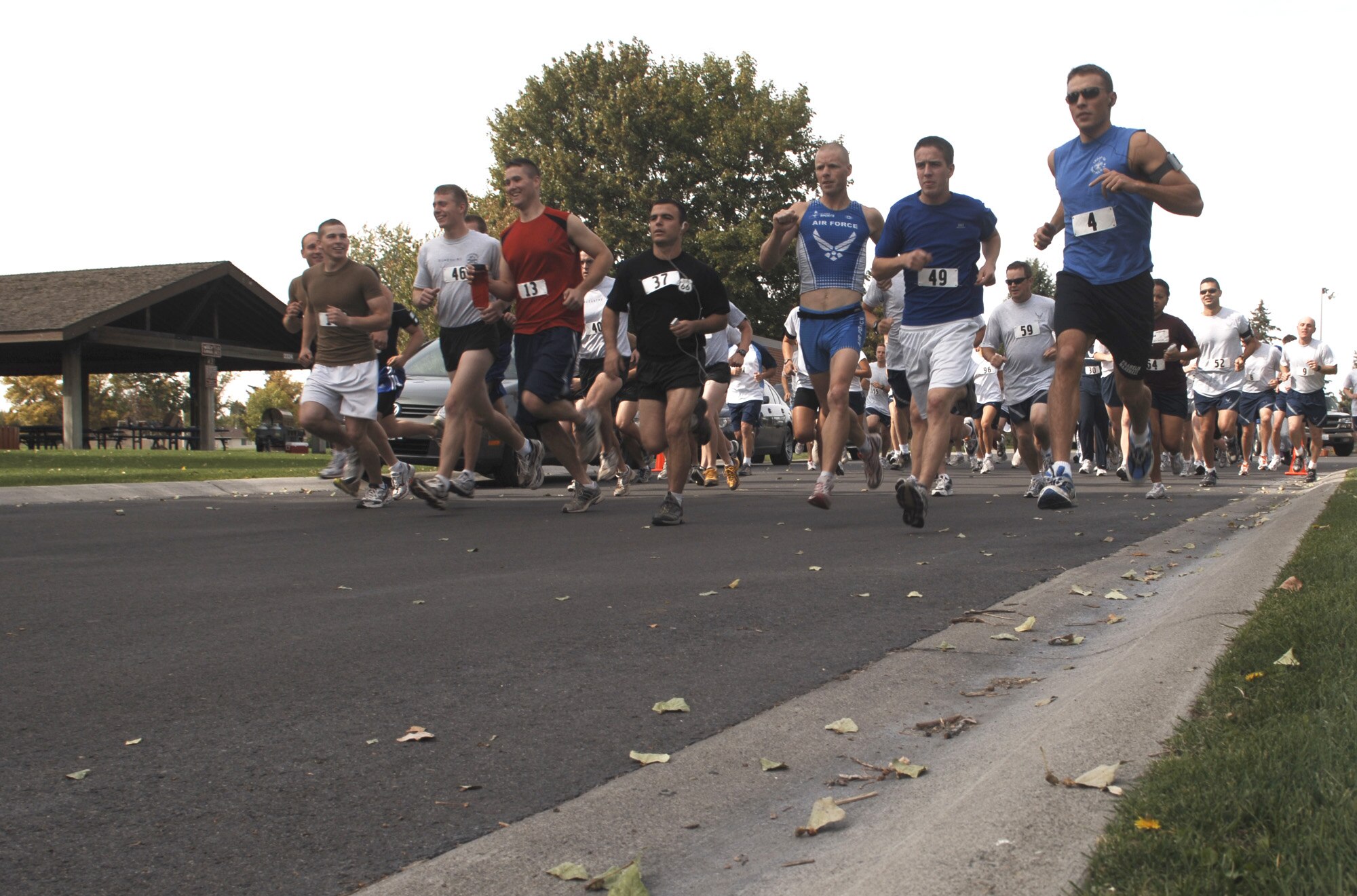 FAIRCHILD AIR FORCE BASE, Wash. – About 50 runners take off for their choice of a 5- or 10-kilometer run during the Diamond Dash here Sept. 27. The event, hosted by Fairchild’s first sergeants, raises money for Operation Warm Heart, a program that provides meals to Airmen over the holidays. Master Sgt. Douglas Crossen, 92nd Communications first sergeant, said the shirts chose to raise funds with a run because it also “promotes fitness, esprit de corps, morale and welfare throughout the wing.” (U.S. Air Force photo/Senior Airman Chad Watkins)