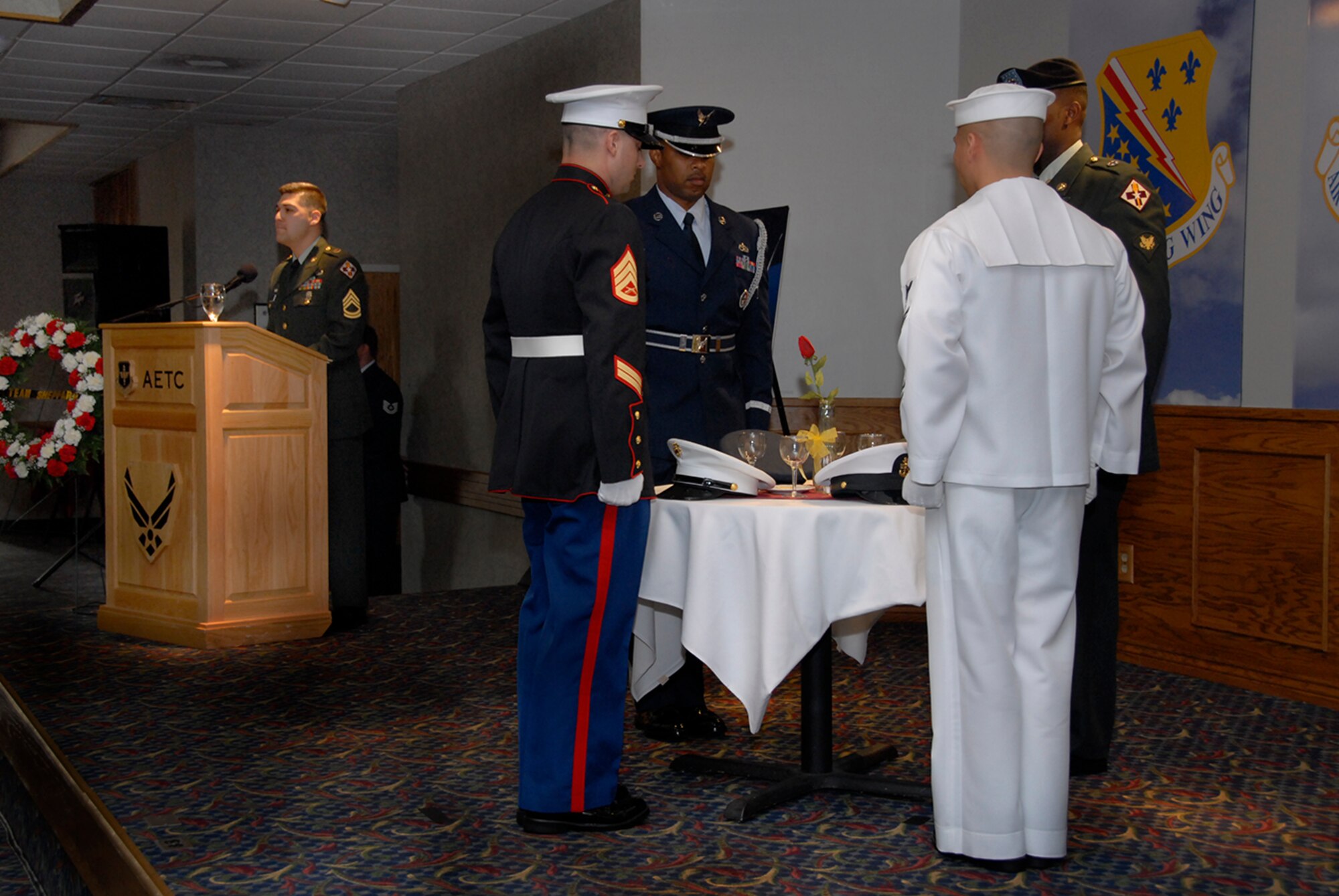 Members of the United States Army, Navy, Air Force and Marines honor their captured and missing fellow servicemembers during the POW/MIA luncheon at the Sheppard Club Sept. 28.  (U.S. Air Force photo/Sandy Wassenmiller)