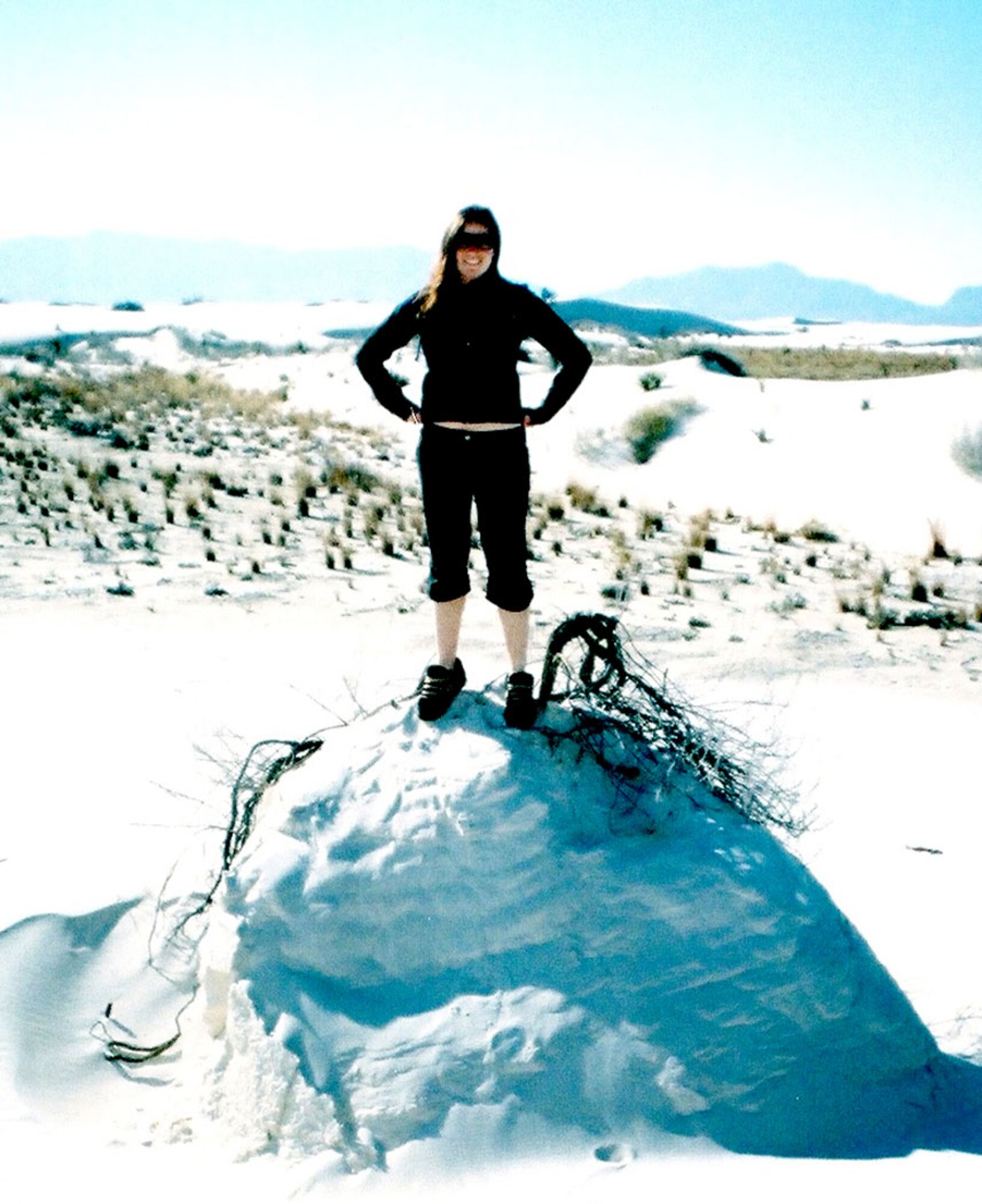 Airman 1st Class Katerina Slivinske, 49th Communications Squadron, tops a sand mound at White Sands National Monument during the Explore the Friendliest Place on Earth week, Sept. 24-25 and 27-28. (U.S. Air Force photo courtesy of Airman 1st Class Katerina Slivinske)