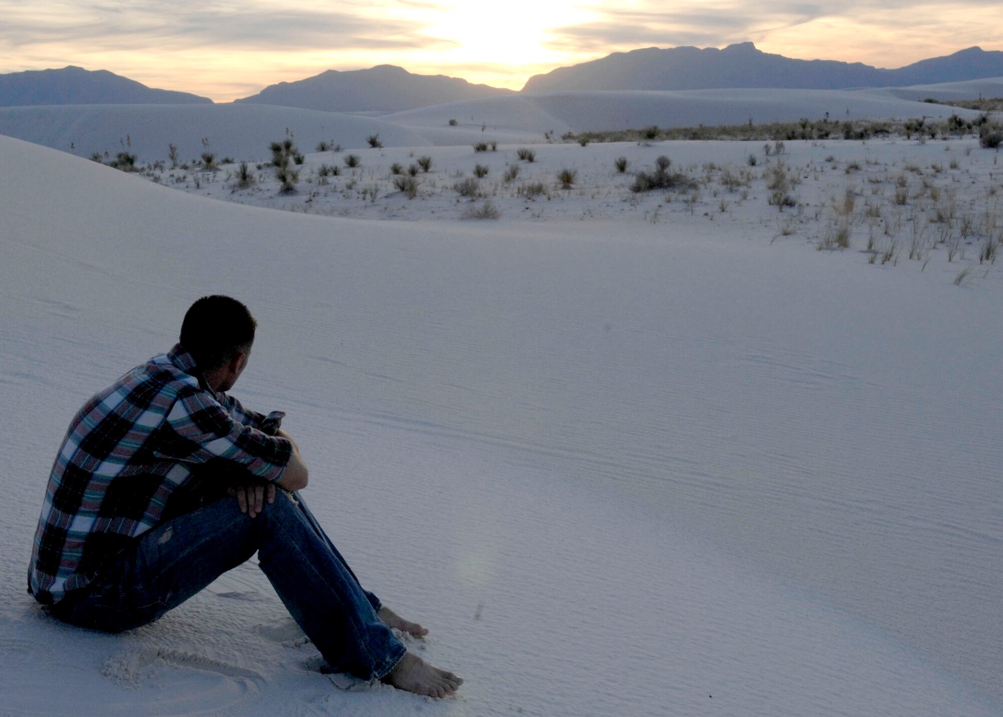 Airman 1st Class John Western, 49th Logistics Readiness Squadron, watches the sun set at White Sands National Monument during the Explore the Friendliest Place on Earth week, Sept. 24-25 and 27-28. (U.S. Air Force photo courtesy of Airman 1st Class Rachel Kocin)