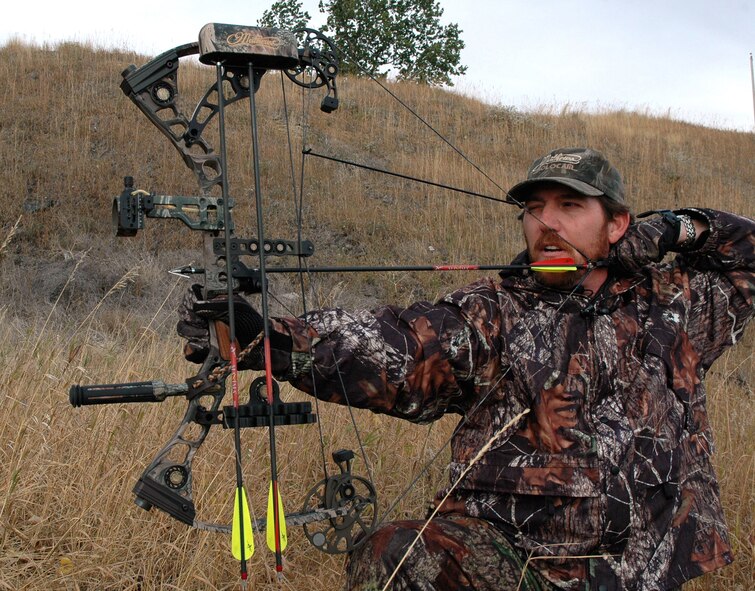 Nick Montagno, 341st Security Support Squadron combat arms instructor, draws back on the bow while aiming at a target Oct. 2 at Malmstrom Air Force Base, Mont. (U.S. Air Force photo/Staff Sgt. Marcus McDonald).