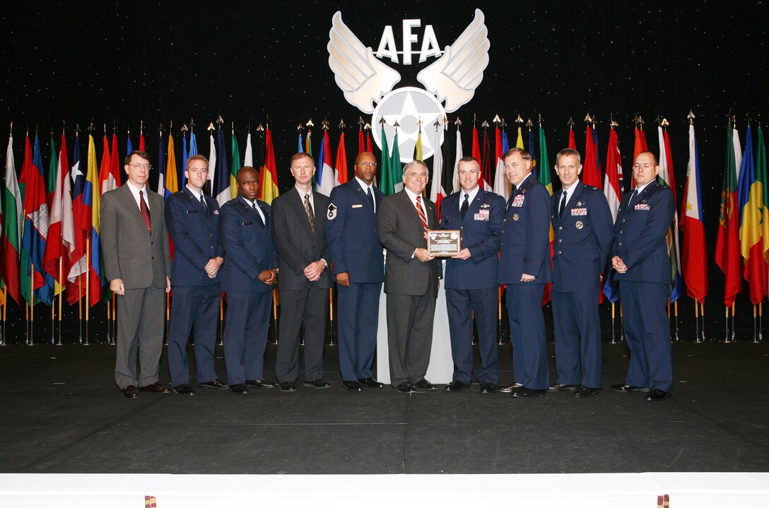 The Air Force Operational Test and Evaluation Center Small Diameter Bomb Test Team were named the Air Force Association's 2007 Test and Evaluation Team of the Year. The AFOTEC Detachment 2 team, based at Eglin AFB, Fla., received their award during the September 24-26 Air and Space Conference and Technology Exposition in Washington, D.C. Pictured from left to right are: Col. (retired) Dan Grenier, former AFOTEC Det. 2 commander; Capt. Robert Harder, team member; Capt. Craig Williams, team member; Mr. Roger Floyd, team member; MSgt. Anthony Kage, team member; Mr. Robert Largent, AFA Chairman of the Board; Col. Tom Bell, AFOTEC Det. 2 commander; Maj. Gen. Stephen Sargeant, AFOTEC commander; Col. Chris Choate, team member; and Maj. Charles Williams, team member. (Photo courtesy of the Air Force Association)