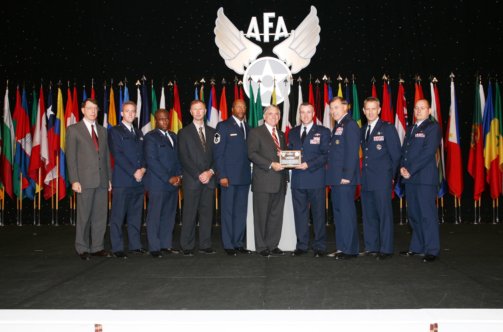 The Air Force Operational Test and Evaluation Center Small Diameter Bomb Test Team were named the Air Force Association's 2007 Test and Evaluation Team of the Year. The AFOTEC Detachment 2 team, based at Eglin AFB, Fla., received their award during the September 24-26 Air and Space Conference and Technology Exposition in Washington, D.C. Pictured from left to right are: Col. (retired) Dan Grenier, former AFOTEC Det. 2 commander; Capt. Robert Harder, team member; Capt. Craig Williams, team member; Mr. Roger Floyd, team member; MSgt. Anthony Kage, team member; Mr. Robert Largent, AFA Chairman of the Board; Col. Tom Bell, AFOTEC Det. 2 commander; Maj. Gen. Stephen Sargeant, AFOTEC commander; Col. Chris Choate, team member; and Maj. Charles Williams, team member. (Photo courtesy of the Air Force Association)