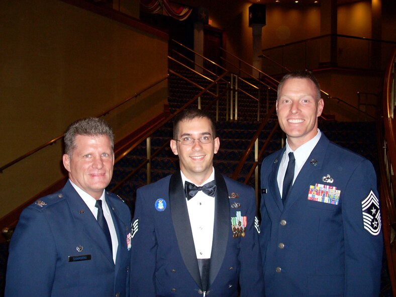 HILL AIR FORCE BASE, Utah-- Col. Scott Chambers, 75th Air Base Wing commander, along with Ogden Air Logistics Center and 75th Air Base Wing Command Chief Master Sgt. Bill Gurney, congratulate Staff Sgt. Matthew Hefti on his award on one of the 12 Outstanding Airman of the Year. (U.S. Air Force courtesy photo)