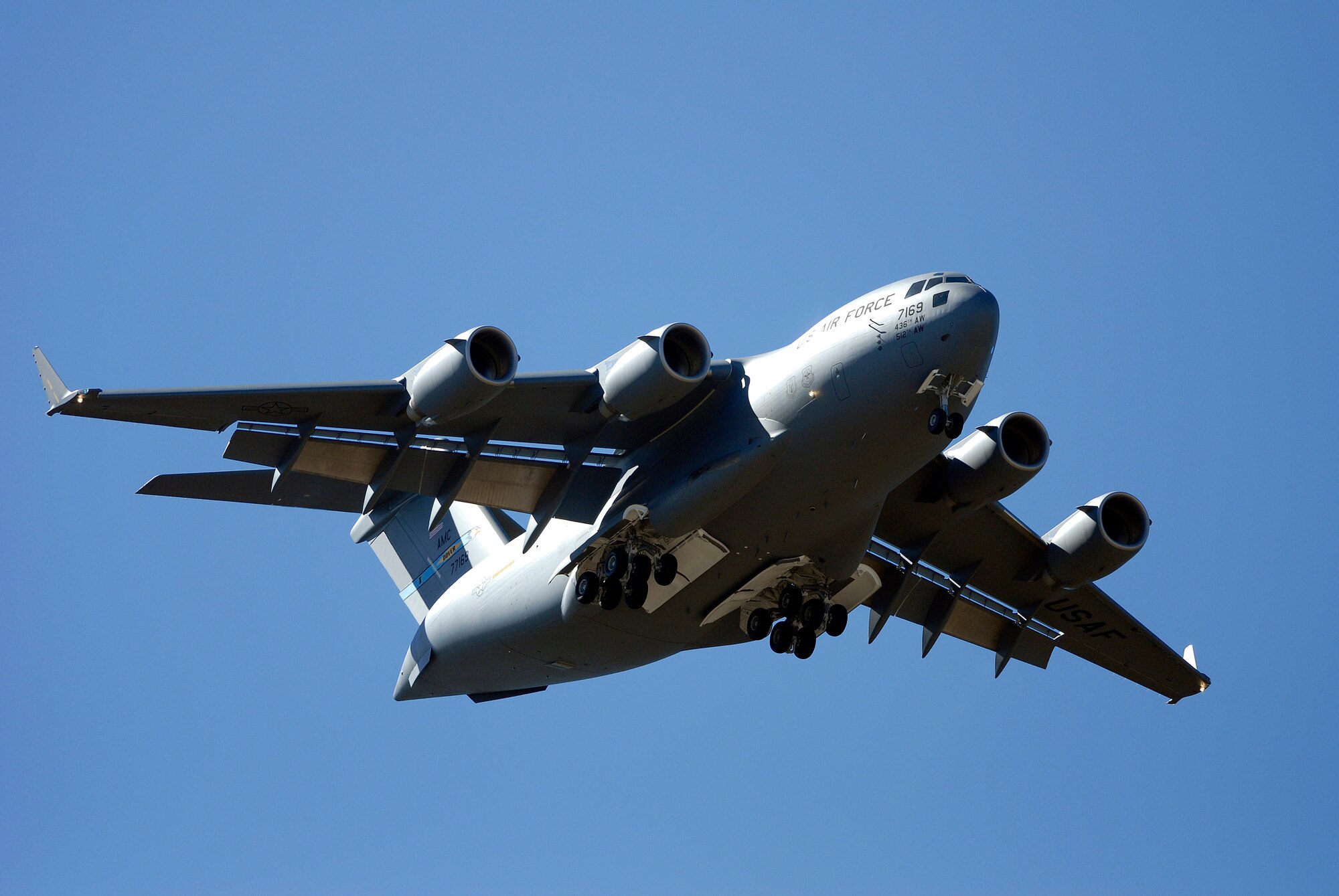 Brig. Gen. Susan Y. Desjardins flies a newly accepted C-17 Globemaster III Oct. 2 over the U.S. Air Force Academy cadet area in Colorado Springs, Colo. General Desjardins accepted the aircraft into the Air Force's inventory at Boeing's facilities in Long Beach, Calif., and flew it from the Boeing facility to its new duty station with the 436th Airlift Wing at Dover Air Force Base, Del. The general, a command pilot with more than 3,800 flying hours in the C-17 and other aircraft, is the Air Force Academy commandant of cadets. (U.S. Air Force photo/Dennis Rogers)
