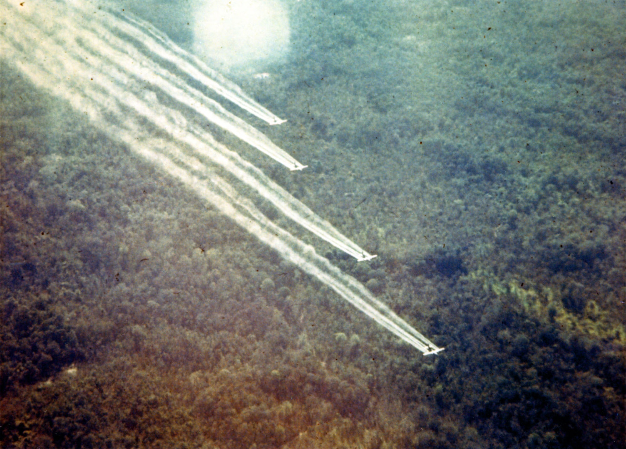 Four-ship formation on a defoliation spray run. (U.S. Air Force photo)
