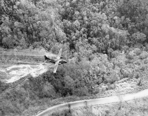 Ranch Hand UC-123 clearing a roadside in central South Vietnam in 1966. Note the aircraft’s very low altitude. (U.S. Air Force photo)