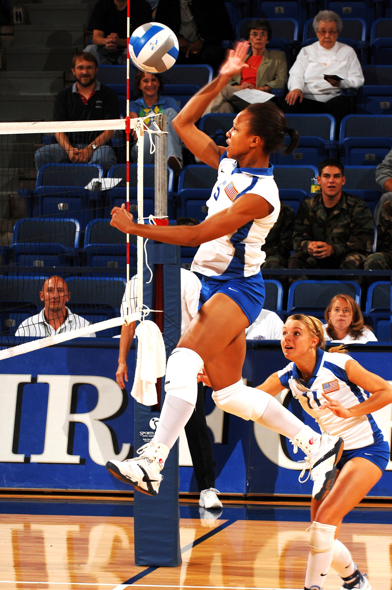 U.S. Air Force Academy sophomore Jocelyn Booker goes to great heights against Utah in volleyball action as the Falcons were swept in three sets Sept. 28 at Clune Arena at the Academy in Colorado. The Falcons return to the road to take on the San Diego State Aztecs Oct. 4 before heading to face the University of Nevada, Las Vegas Oct. 6. (U.S. Air Force photo/Lewis Carlyle) 
