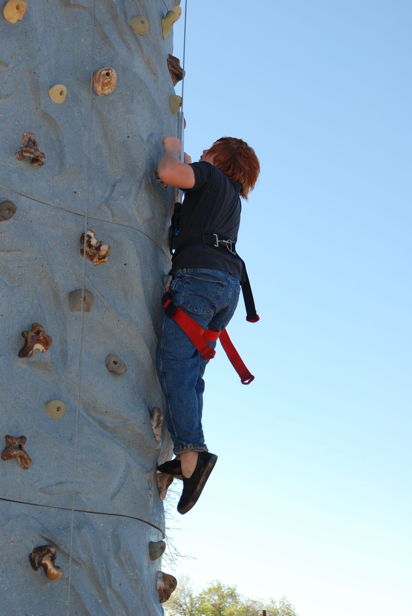 Sam Hazelet, 12, a Boy Scout with the Sutter Creek Boy Scout Troop 63, climbs up a rock wall during the 2007 Boy Scout Expo on Saturday at Dragon Town. (Photo by Airman 1st Class Robert Biermann)