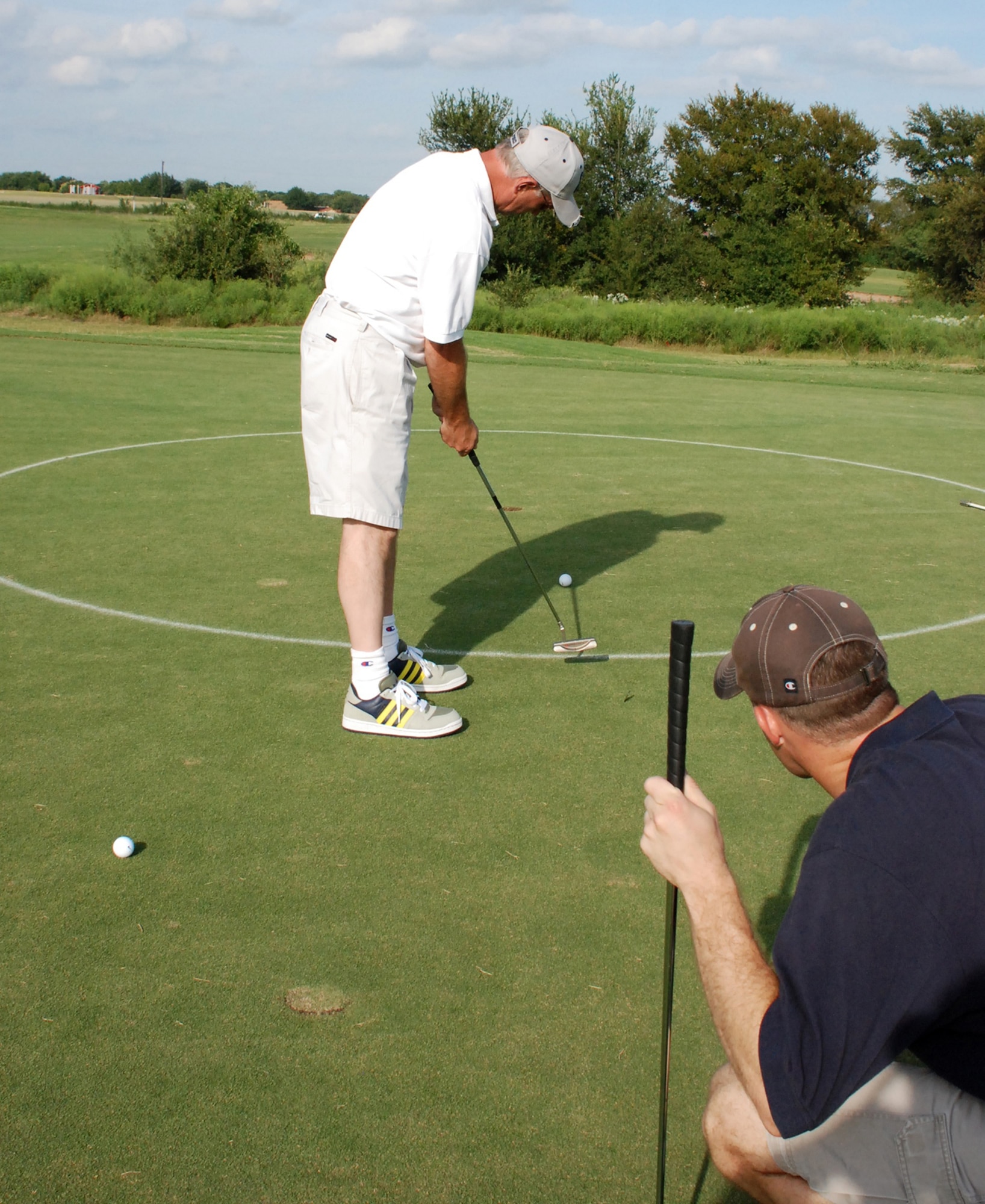 Louie Fehl, III, a flight surgeon at the 457th Fighter Squadron, takes a short putt on the green during the 301st Fighter Wing Annual Awards Banquet Golf Tournament held at the Whitestone course in Benbrook, Texas. A total of 32 four-man teams joined in a day on the links to help raise $6,000 for the upcoming awards banquet planned for Jan. 6, at the Tarrant County Convention Center in Fort Worth.