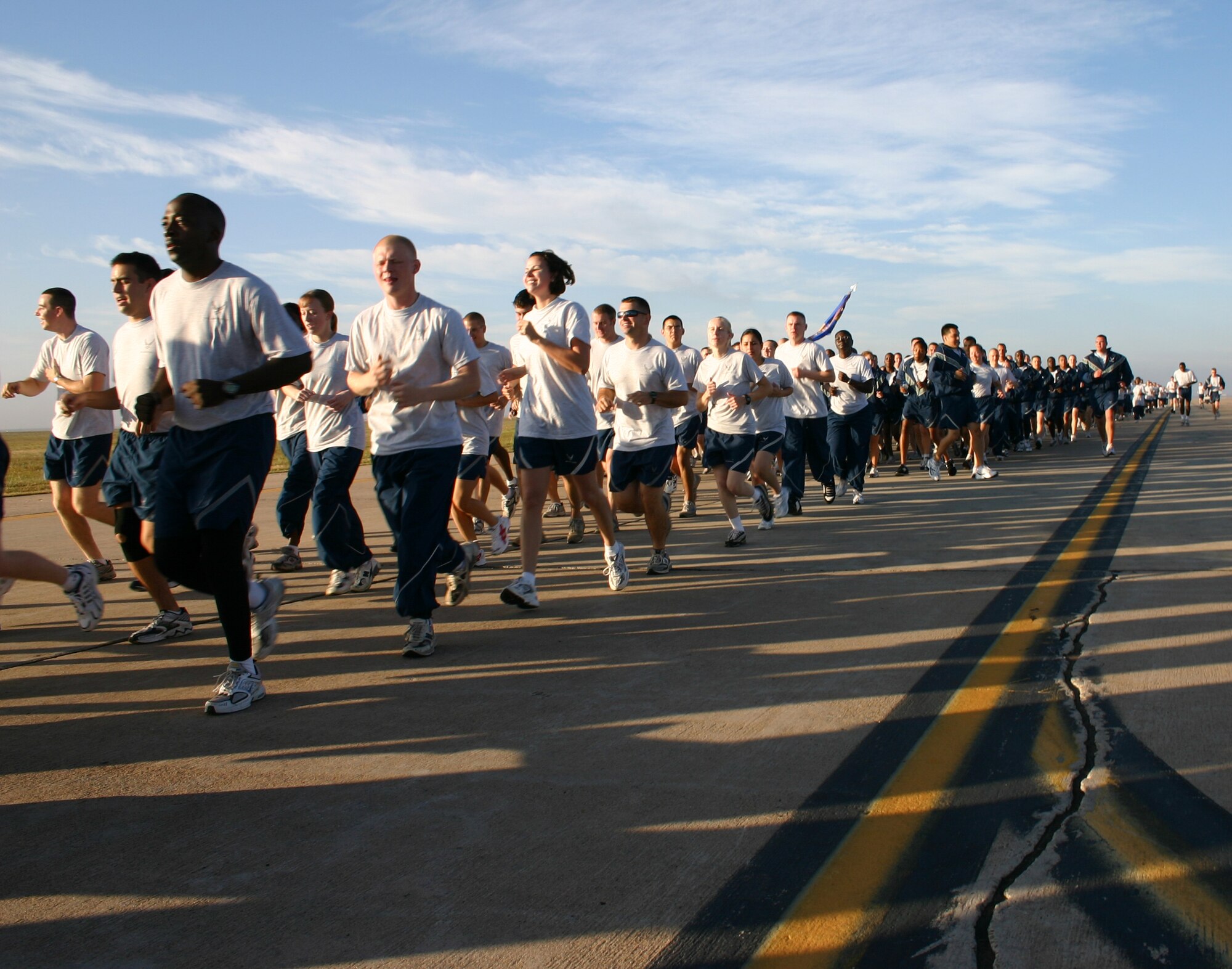 CANNON AIR FORCE BASE, N.M. -- Airmen run during a two-mile commando run on the base flightline Tuesday morning. Airmen from the 27th Special Operations Group and 27th Special Operations Maintenance Group participated in the run. (U.S. Air Force photo by Airman Elliott Sprehe)