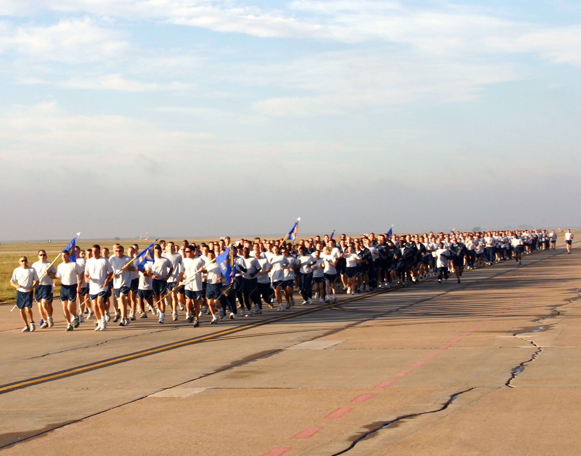 CANNON AIR FORCE BASE, N.M. -- Airmen run in formation during a two-mile commando run on the base flightline Tuesday morning. Airmen from the 27th Special Operations Group and 27th Special Operations Maintenance Group participated in the run. (U.S. Air Force photo by Airman Elliott Sprehe)