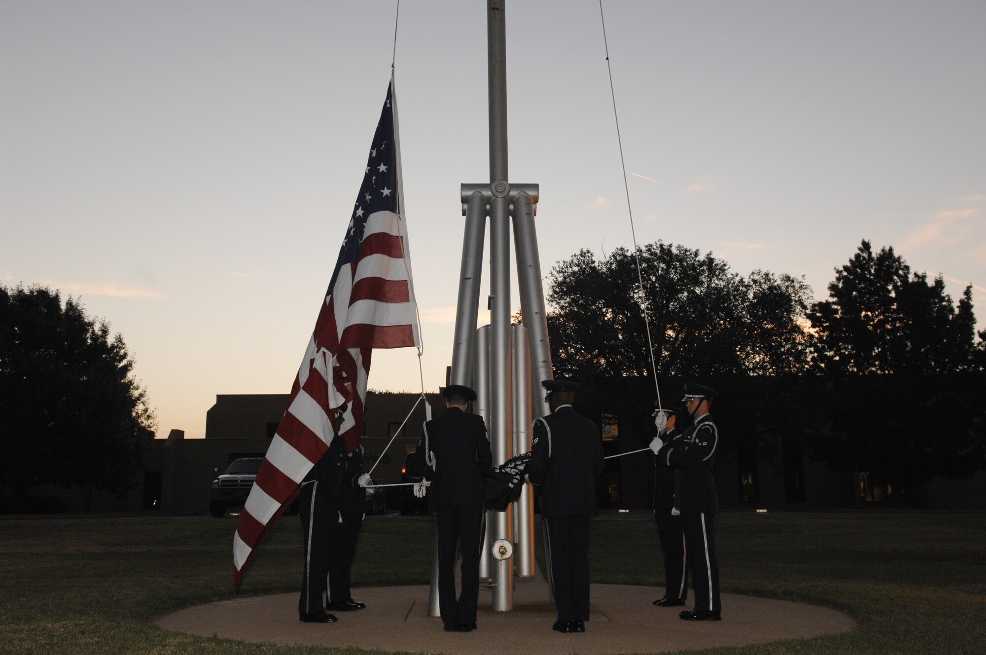 Candles are lit during the POW/MIA day recognition ceremony at the Parade Grounds in remembrance of veterans still missing in action. A list of MIA veterans from Oklahoma was read as a candle was lit for each name. During the ceremony, the Altus Air Force Base Honor Guard raised the U.S. and POW/MIA flags for reveille and performed a 21 Gun Salute. (U.S. Air Force photo/Senior Airman Joshua Demotts)