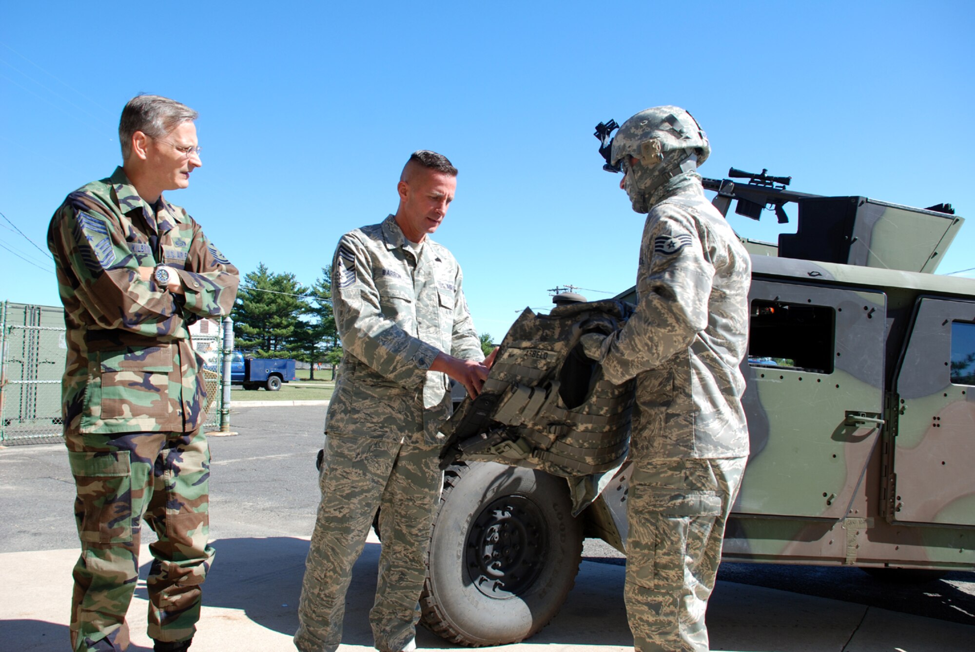 Staff Sgt. Peter Arbelo, 305th Civil Engineer Squadron Explosive Ordnance Disposal technician, shows Air Mibility Command’s Command Chief Master Sgt. Joe Barron, some of the individual protective equipment used by EOD technicians Sept. 17. (U.S. Air Force photo/Staff Sgt. Kelly White)



