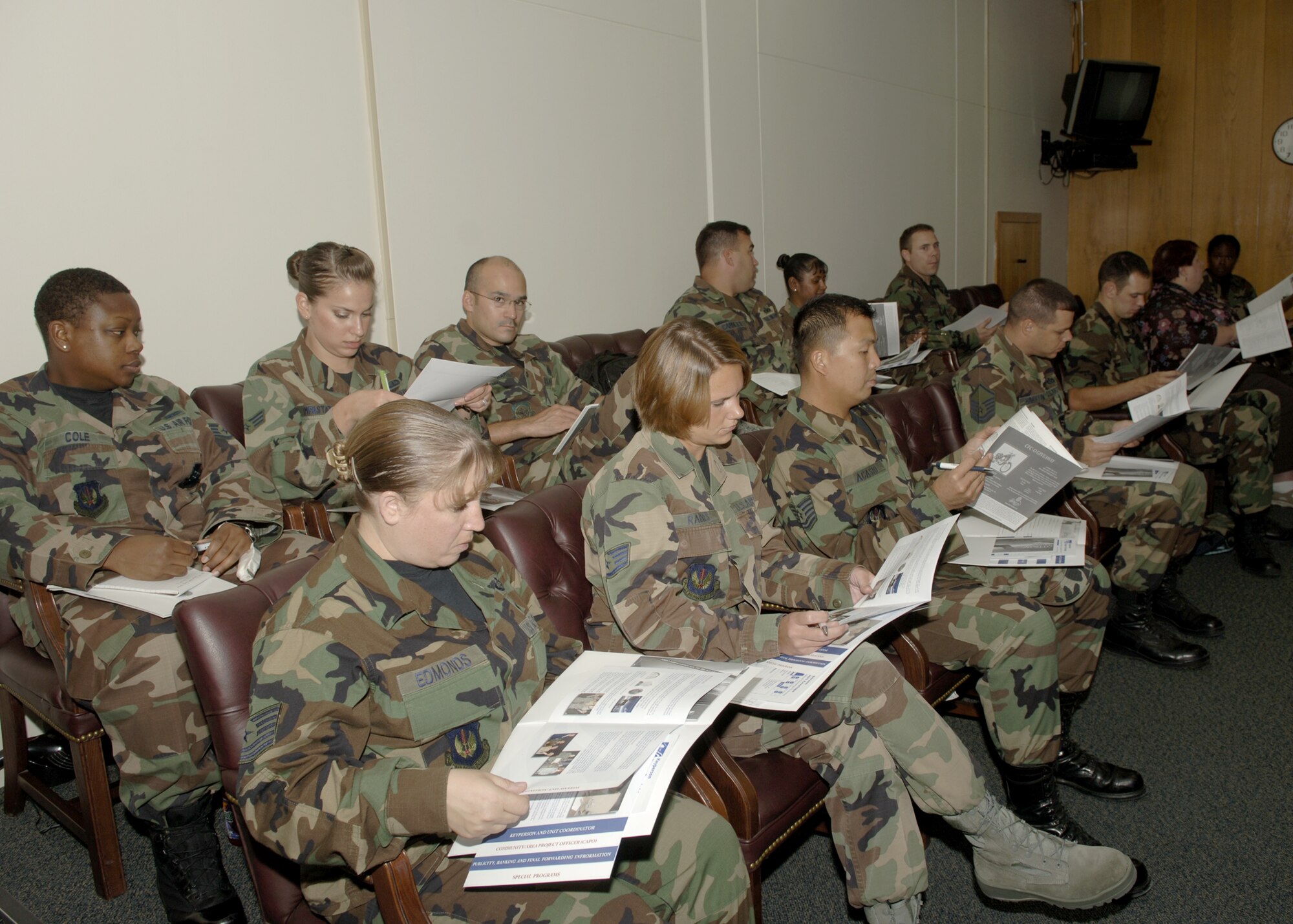 Volunteers from Team Incirlik read their Combined Federal Campaign material before a training session Sept. 26. The CFC is an event that allows members to give back to the community and help those in need. The overseas CFC will last from Oct. 1 through Nov. 30. (U.S. Air Force photo by Senior Airman Tiffany Colburn)
