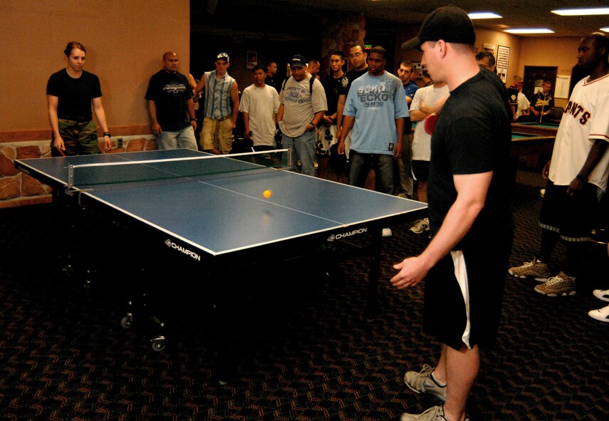 KUNSAN AIR BASE, South Korea - Amanda Biller, supply flight service center representative 8th Logistics Readiness Squadron (left) and Zachary Brown, lead weapons crew 8th Aircraft Maintenance Group compete against one another during a ping-pong tournament Sept. 28 here. Biller and Brown, along with other 8th Fighter Wing Airmen, participated in various events during the Wing Sports Day. The sports day allows Airmen a way to compete in friendly and fun competitions, while helping to build esprit de corps. The day kicked off with a wing run and events, ranging from a Texas Hold 'Em tournament to unit paintball challenges. (U.S. Air Force photo/ TSgt Quinton T. Burris)   