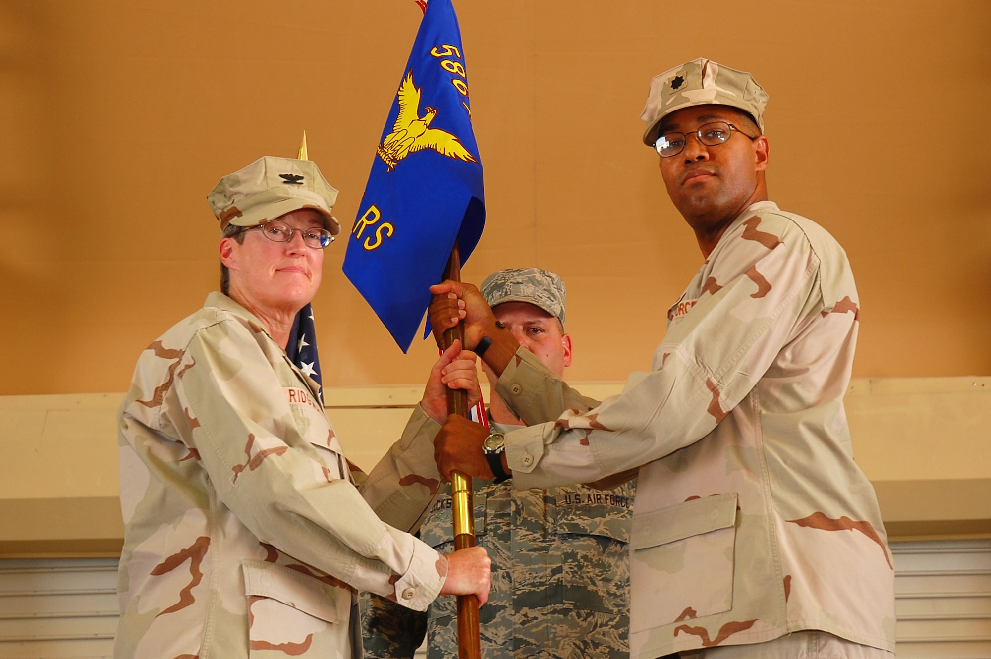 SOUTHWEST ASIA -- 586th Expeditionary Logistics Readiness Squadron change of command. Lt. Col. Kevin Sampels assumed command of the squadron from Lt. Col. Daryl Cunningham at an undisclosed location Sept. 28. (U.S. Air Force photo by Staff Sgt. Tia Schroeder)