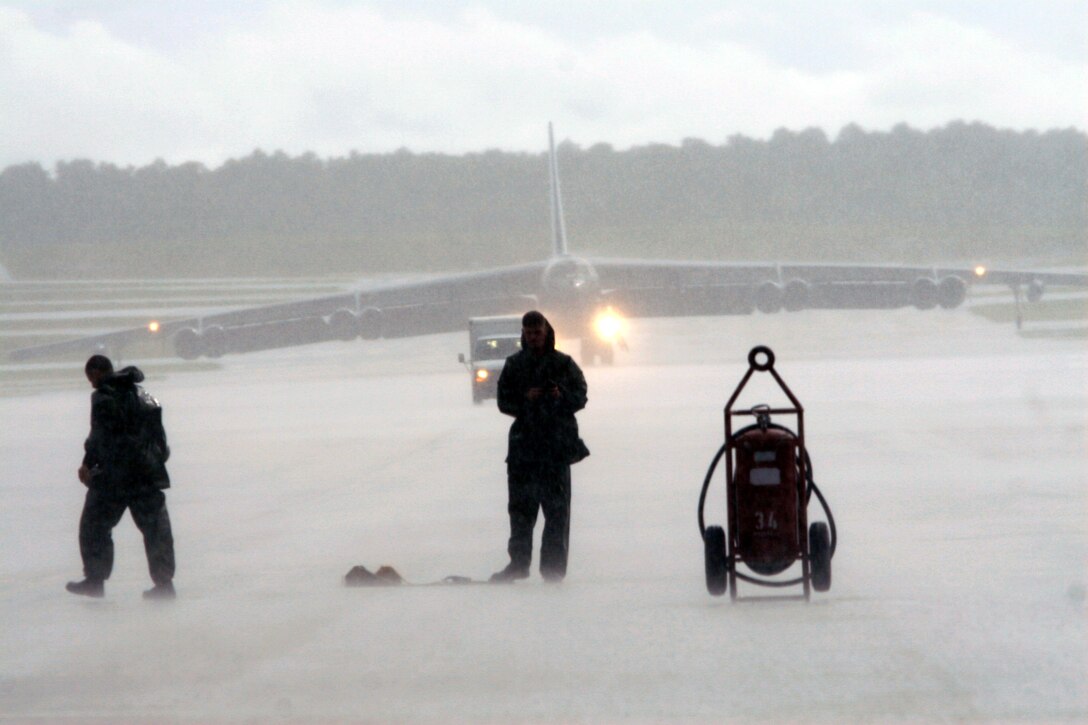 The “game doesn’t get called for weather” if you’re an aircraft maintainer. Their job involves working in a variety of conditions to ensure America’s tip of the spear forces, our strategic bombers, are always mission capable. These maintainers are waiting to service their deployed B-52s while at the same time enduring one of Guam’s torrential downpours. “As hard as we work though, (I enjoy) knowing that when that jet takes off full of bombs, a convoy or patrol is safe with a B-52 that I pre-flighted and launched,” said Senior Airman Jason Stephens, 36th EAMXS. (Air Force photo/Senior Master Sgt. Rasouliyan)