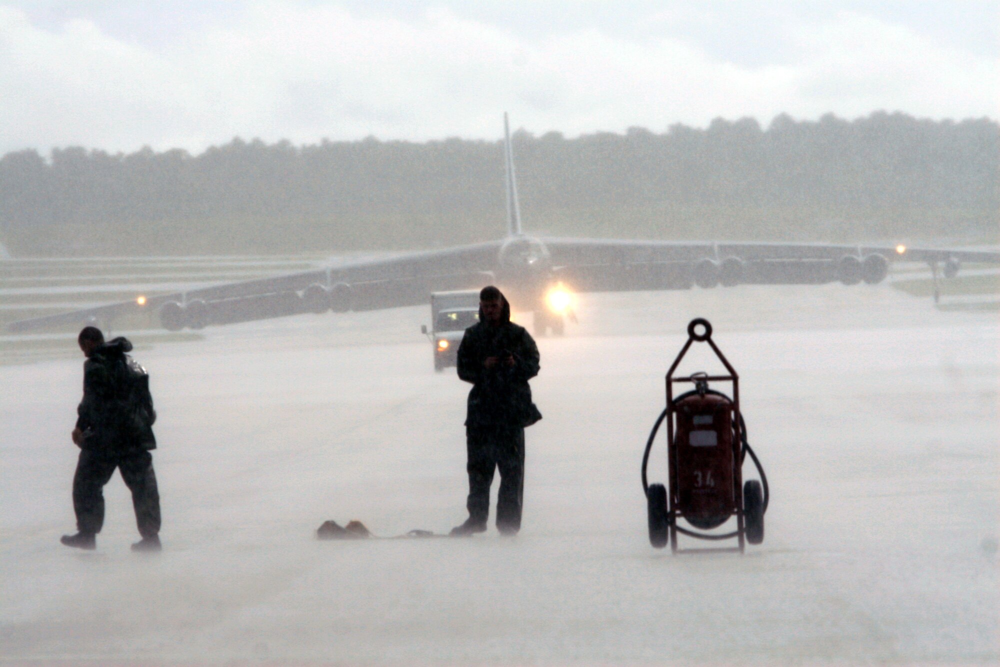 The “game doesn’t get called for weather” if you’re an aircraft maintainer. Their job involves working in a variety of conditions to ensure America’s tip of the spear forces, our strategic bombers, are always mission capable. These maintainers are waiting to service their deployed B-52s while at the same time enduring one of Guam’s torrential downpours. “As hard as we work though, (I enjoy) knowing that when that jet takes off full of bombs, a convoy or patrol is safe with a B-52 that I pre-flighted and launched,” said Senior Airman Jason Stephens, 36th EAMXS. (Air Force photo/Senior Master Sgt. Rasouliyan)