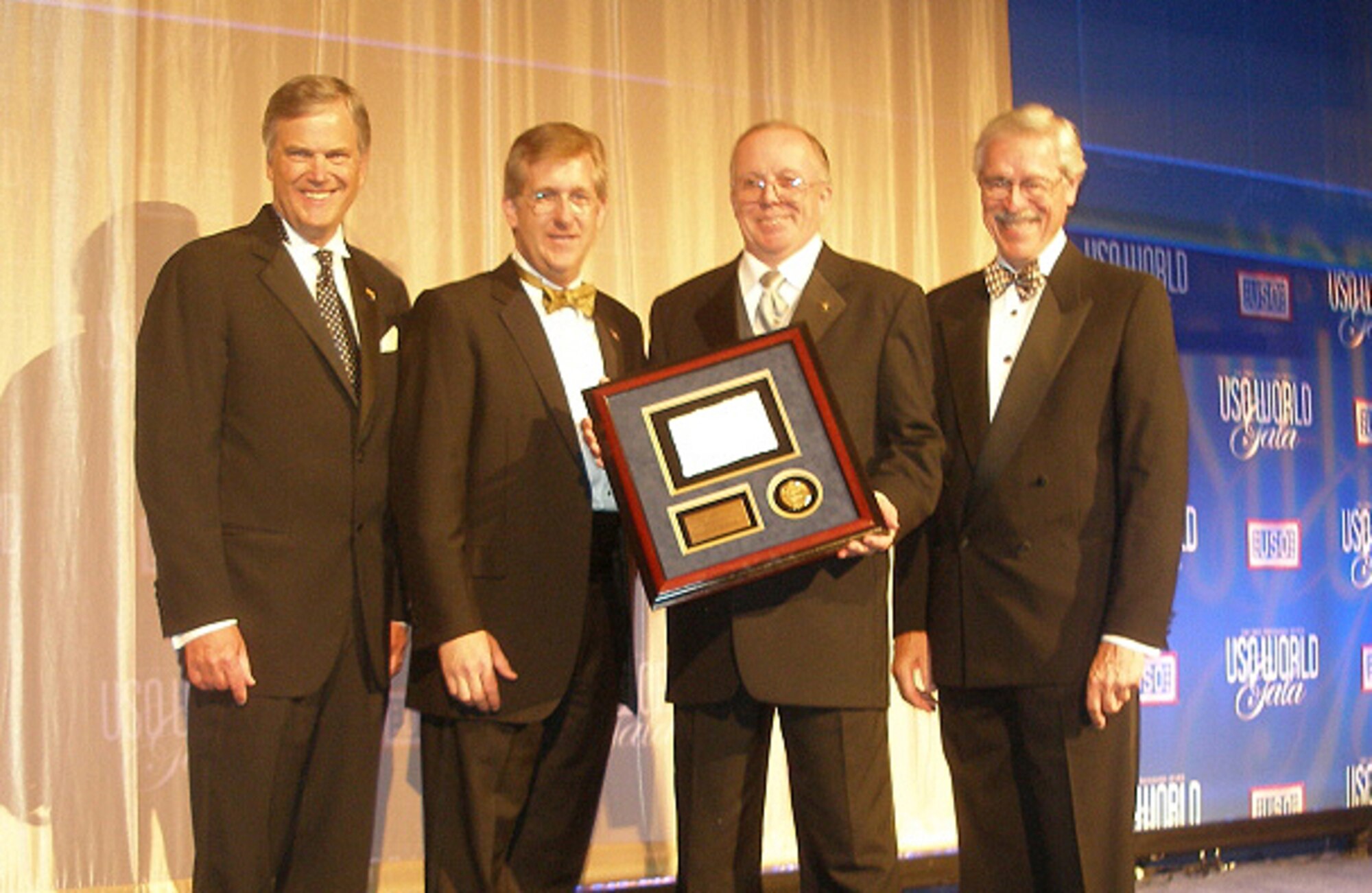 (Left to right) Edward Powell, Jr., United Services Organization World Headquarters president, Dave McIntyre, TriWest Health Care Alliance president, Dave Wilson, 2007 USO Volunteer of the Year Award winner, and William Moll, USO World Board of Governers chairman, meet at the USO World Gala in Washington, D.C., Sept. 21. Mr. Wilson was presented the award at the event. (Courtesy photo)