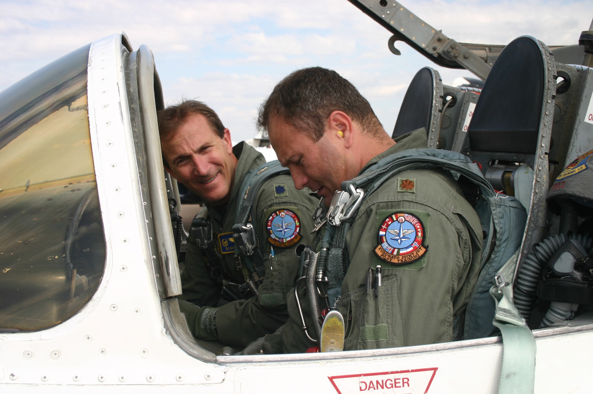 Lt. Col. Bo McGowan, left, and Maj. Jeff Grayson, members of the 97th Flying Training Squadron, prepare for their four-ship formation flight Oct. 2.  This will be the last such formation flight at Sheppard for the T-37 Tweet as the transition to the T-6 Texan begins in 2008. (U.S. Air Force photo/Staff Sgt. Tonnette Thompson)