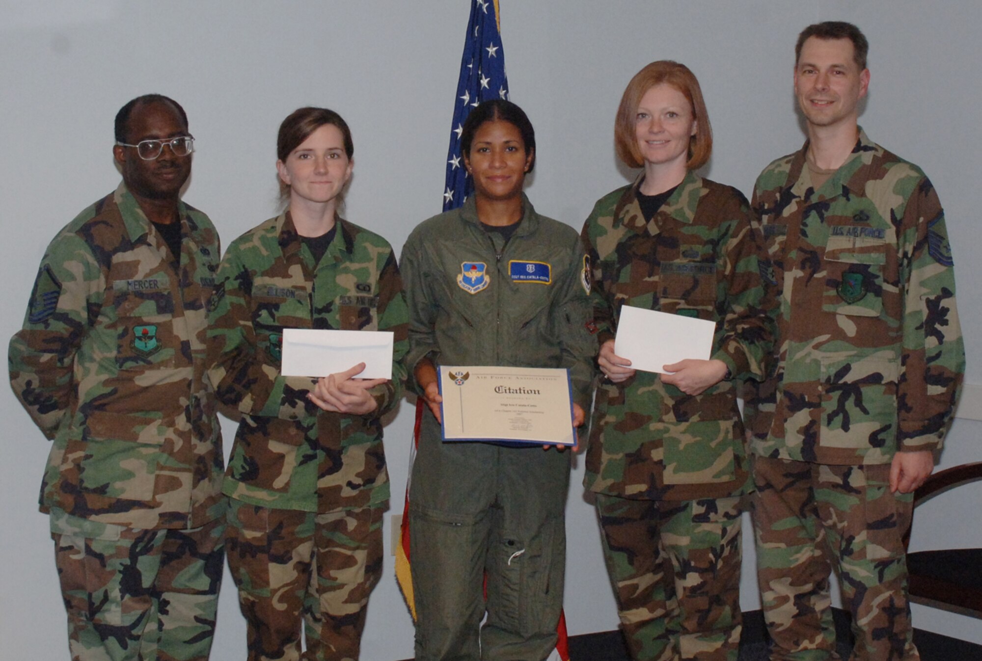 The Columbus AFB Top 3 hosted an enlisted essay contest sponsored by the local Air Force Association Chapter and the Officers Spouses' Council. The essay titled "Why I Vote" was in line with the upcoming election and sought to solicit informative aspects from a Junior Enlisted perspective.  Staff Sgt. Iris Catala-Cotto of the 14th Medical Group was the AFA $500 first place recipient. The winner for the non-commissioned officer cateogry was Staff Sgt. Mackenzie Lombardo, 14th MIssion Support Squadon. She received a $125 Officer Spouses Council scholarship. The winner in the Airman category was Senior Airman Kathleen Ellison, 14th Operations Support Squadron. The winners are pictured here with Master Sgt. Isvan Mercer, left, Top 3 president, and Master Sgt. David Sauer, essay coordinator, (U.S. Air Force photo by Airman 1st Class Danielle Powell)