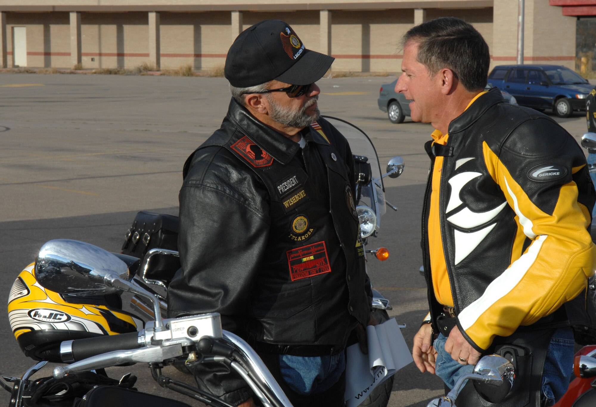 Brig. Gen. David Goldfein, 49th Fighter Wing commander, is greeted by Mr. Ed "Wishbone" Summerall, American Legion Riders chapter 8 president, before taking off to Brooke Army Medical Center, San Antonio. The riders brought comfort and personal items and monetary donations to the center for Operation Wounded Warrior. (U.S. Air Force photo/Airman 1st Class John Strong)