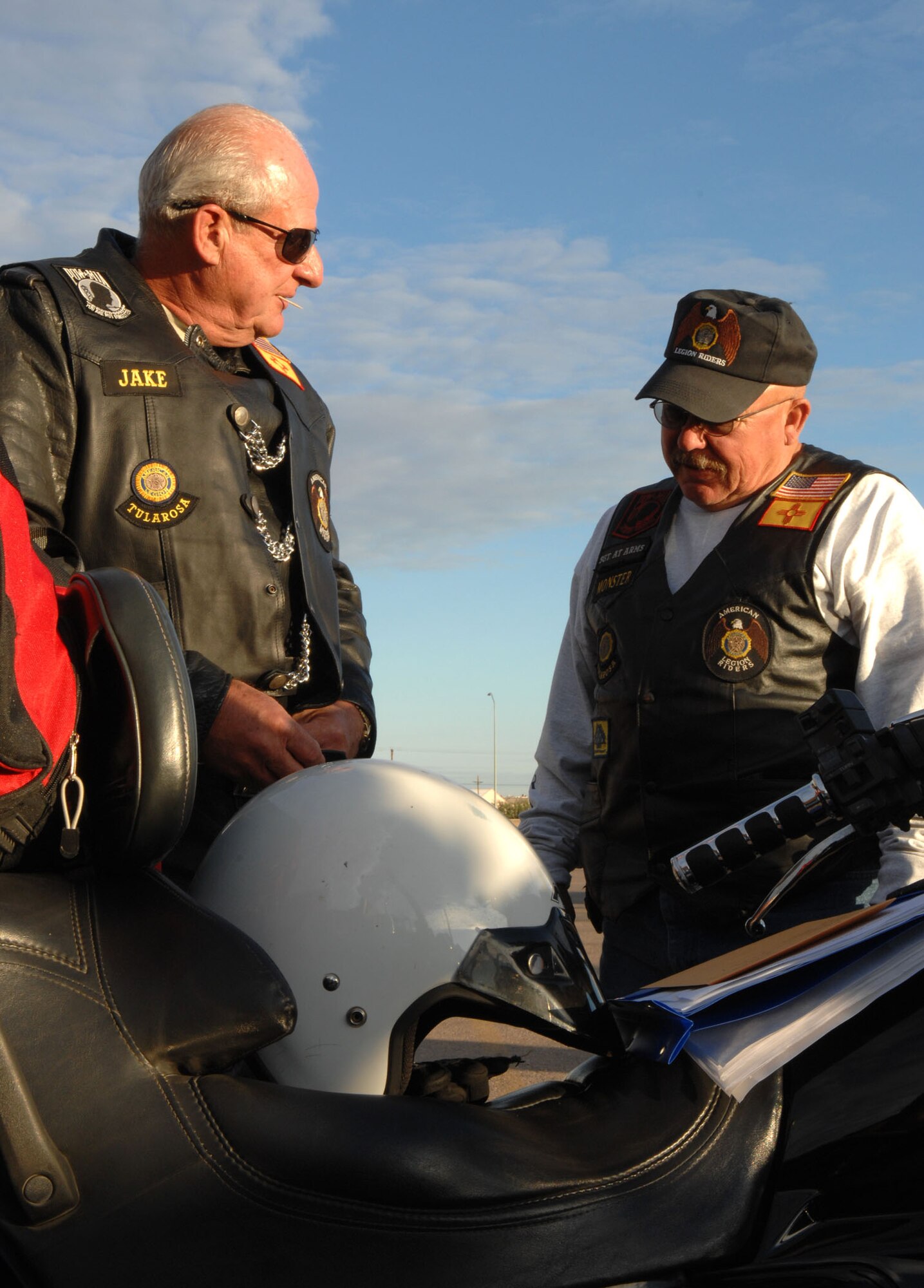 Two members of the American Legion Riders get ready for the road trip to Brooke Army Medical Center, San Antonio. The riders brought comfort and personal items and monetary donations to the center for Operation Wounded Warrior. (U.S. Air Force photo/Airman 1st Class John Strong)