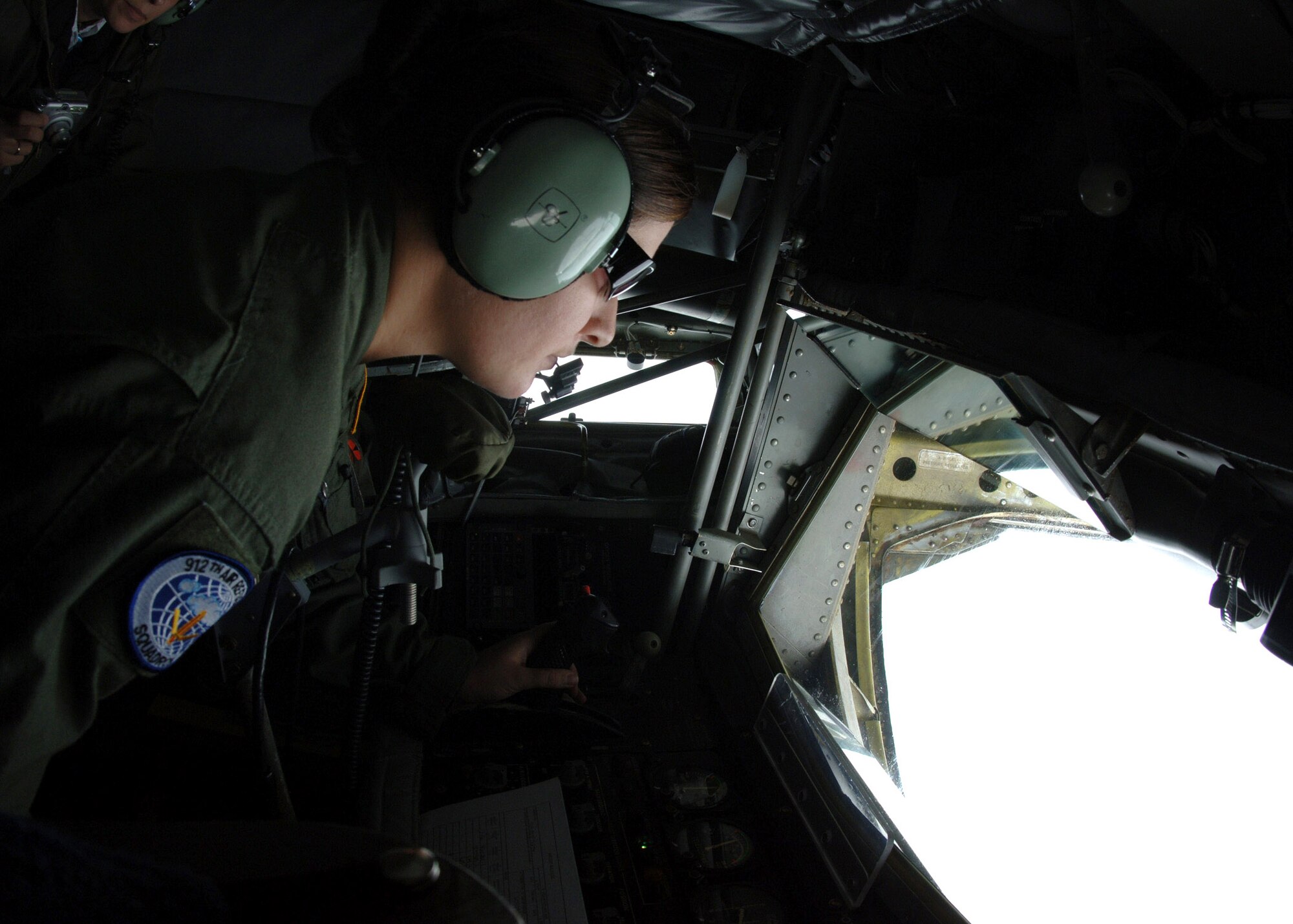 Senior Airman Whitney Bankston prepares to administer fuel to an Air Force Thunderbird during a air refueling mission Oct. 1 over the Midwestern United States. Airman Bankston is assigned to the 912th Air Refueling Squadron from Grand Forks Air Force Base, N.D. (U.S. Air Force photo/Airman 1st Class Chad M. Kellum)