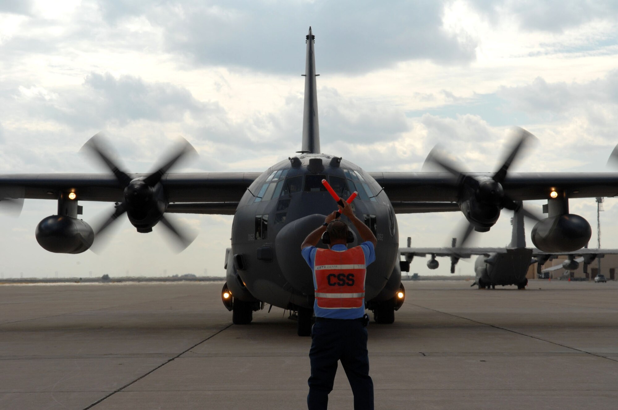 A crew chief leads in a C-130 Hercules Sept. 29 after landing at Cannon Air Force Base, N.M. Air Force Special Operations Command leaders assumed command of Cannon in a redesignation and change-of-command ceremony Oct. 1. (U.S. Air Force photo/Staff Sgt. April Wickes) 