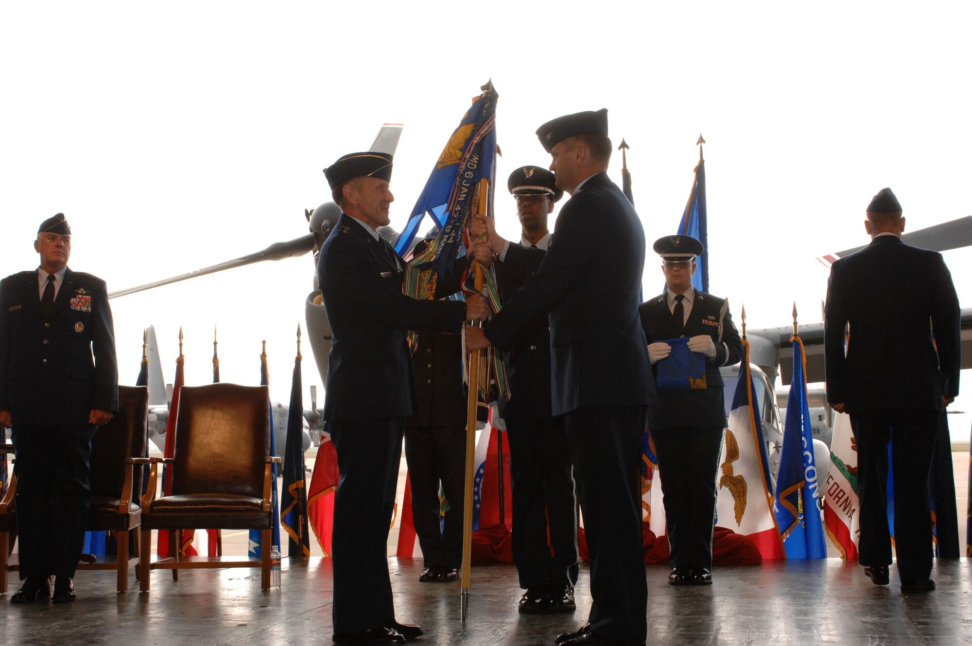 Lt. Gen. Norman R. Seip (left) accepts the guidon from Col. Scott West as he relinquishes command of the 27th Fighter Wing in a change-of-command ceremony Oct. 1. The ceremony inactivated the 27th FW, which was then redesignated as the 27th Special Operations Wing. General Seip is the 12th Air Force commander (U.S. Air Force photo/Airman 1st Class Evelyn Chavez) 