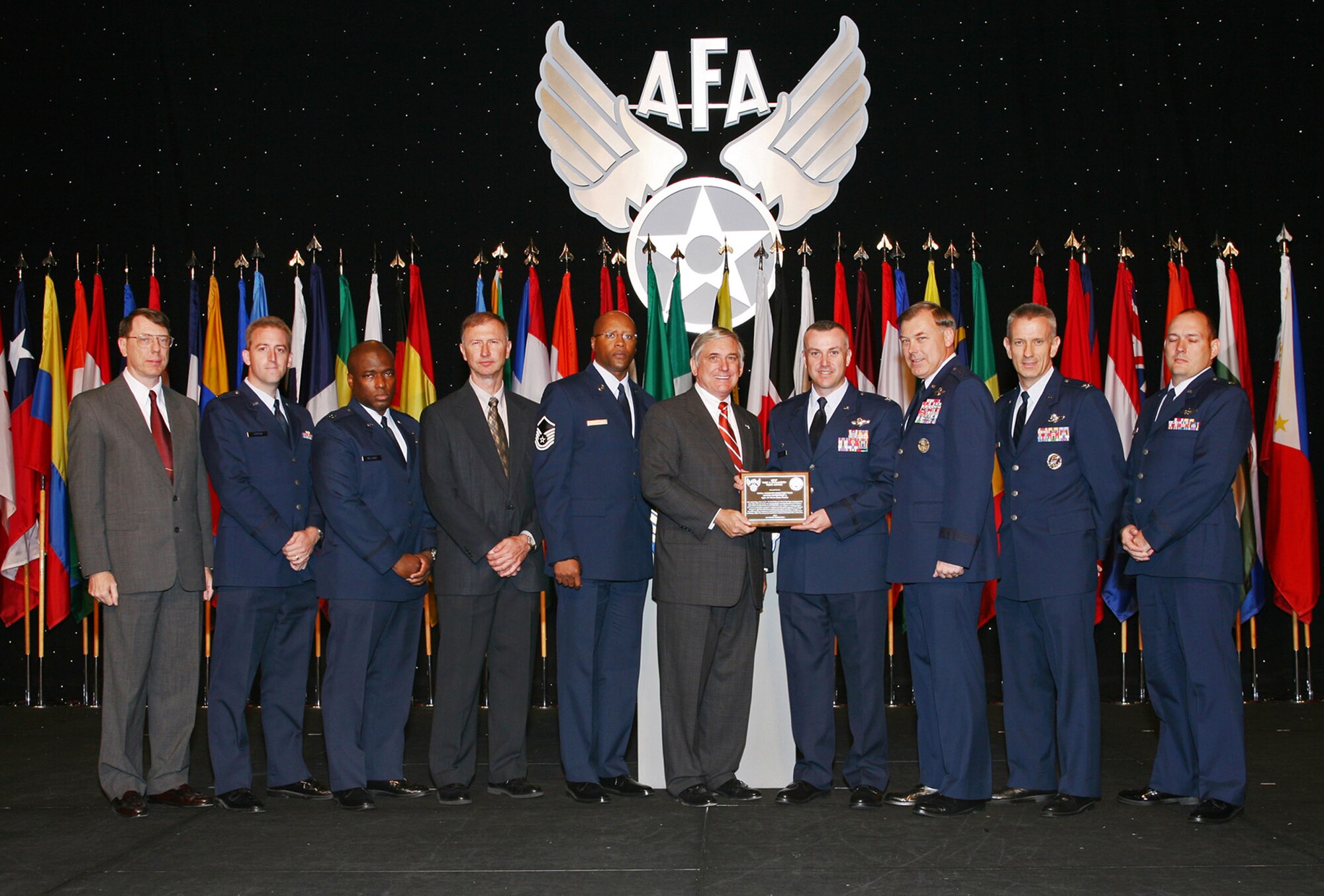 The Air Force Operational Test and Evaluation Center's Small Diameter Bomb Test Team receives the Air Force Association's 2007 Test and Evaluation Team of the Year Award. The AFOTEC Det. 2 team, based at Eglin Air Force Base, Fla., received the award Sept. 24 at the Air & Space Conference and Technology Exposition in Washington. Pictured from left to right are: retired Col. Dan Grenier, the former AFOTEC Det. 2 commander; team members Capt. Robert Harder, Capt. Craig Williams, Roger Floyd and  Master Sgt. Anthony Kage; Robert Largent, the AFA chairman of the board; Col. Tom Bell, the AFOTEC Det. 2 commander; Maj. Gen. Stephen Sargeant, the AFOTEC commander; and team members Col. Chris Choate, and Maj. Charles Williams. (Courtesy photo) 
