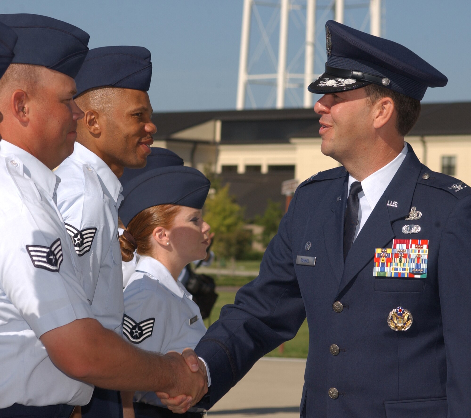 Staff Sgt. James Clark, 336th Training Squadron military training leader, greets Colonel Touhill at the change-of-command ceremony Tuesday.  (U.S. Air Force photo by Kemberly Groue)
