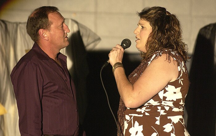 Coast Guard Chief Petty Officer Mike Hemphill, Naval Engineering Support Unit Charleston, and his wife Kim, sing "You Don?t Bring Me Flowers" at the 2007 Family and Teen Talent Contest. (U.S. Air Force photo/Tech. Sgt. Paul Kilgallon)                