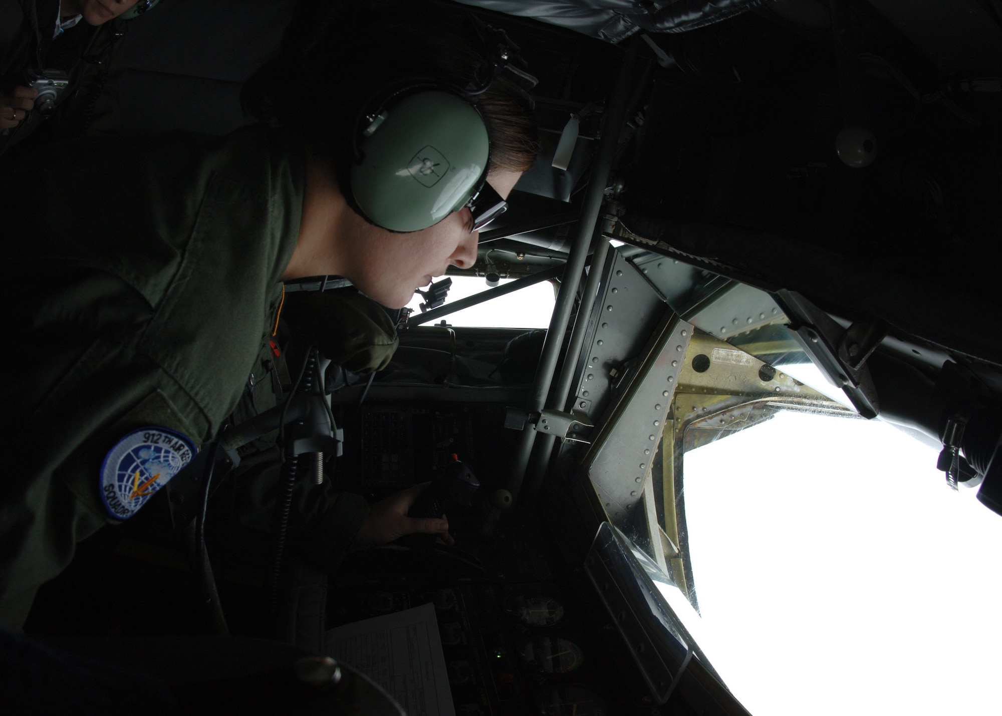 GRAND FORKS AIR FORCE BASE, N.D. -- Senior Airman Whitney Bankston, 912th Air Refueling Squadron, prepares to administer fuel to an Air Force Thunderbird over the Midwestern United States during a Air Refueling mission on October 1, 2007.  (U.S. Air Force photo by Airman 1st Class Chad M. Kellum)