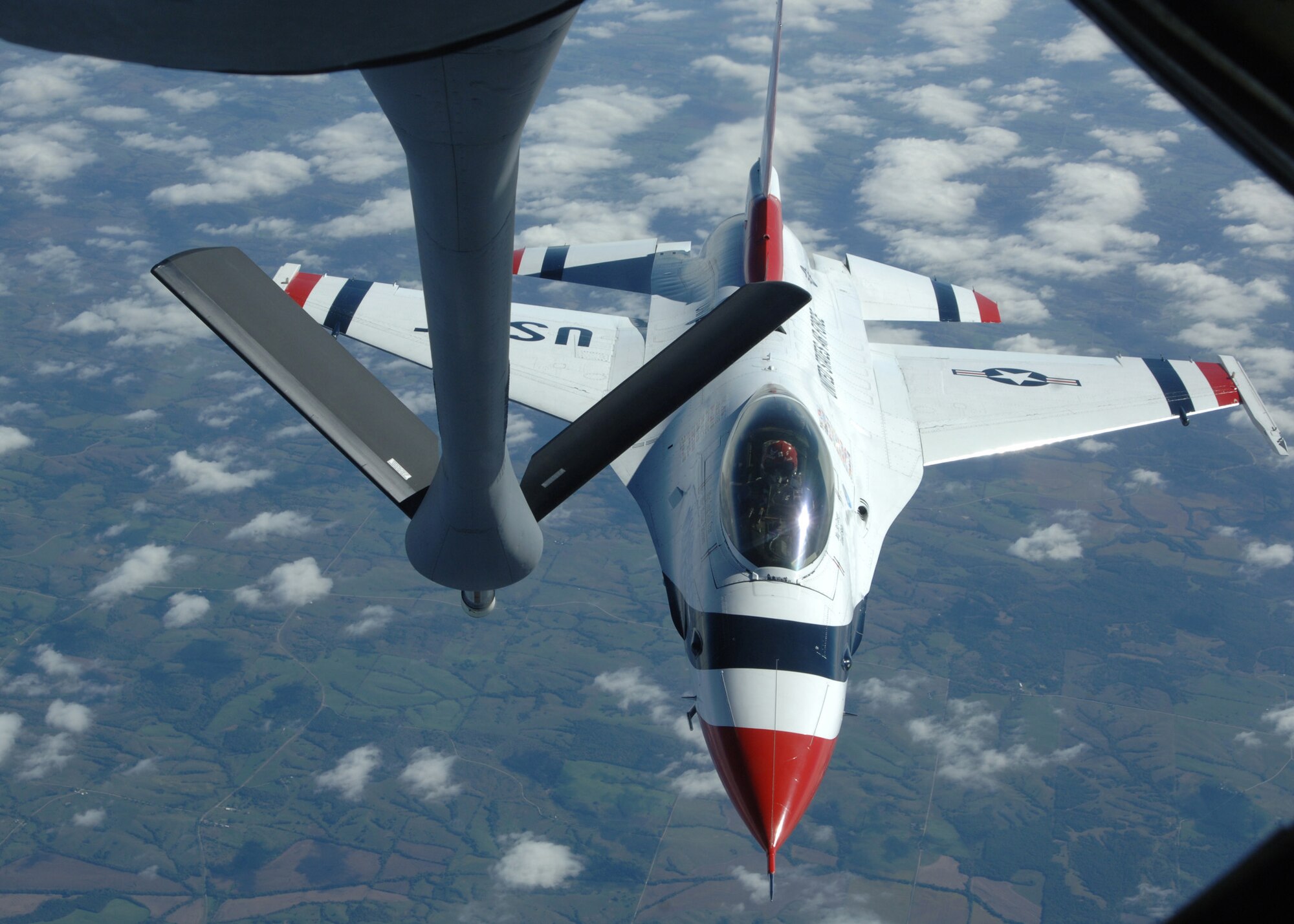 GRAND FORKS AIR FORCE BASE, N.D. -- A U.S. Air Force Thunderbirds pilot, pulls away after taking on fuel from a 319th Air Refueling Wing tanker Oct. 1 over the Midwest during a refueling mission. The Thunderbirds are the Air Force?s premier demonstration squadron. The F-16 team represents the Air Force throughout the nation and abroad. (U.S. Air Force photo by Airman 1st Class Chad M. Kellum)