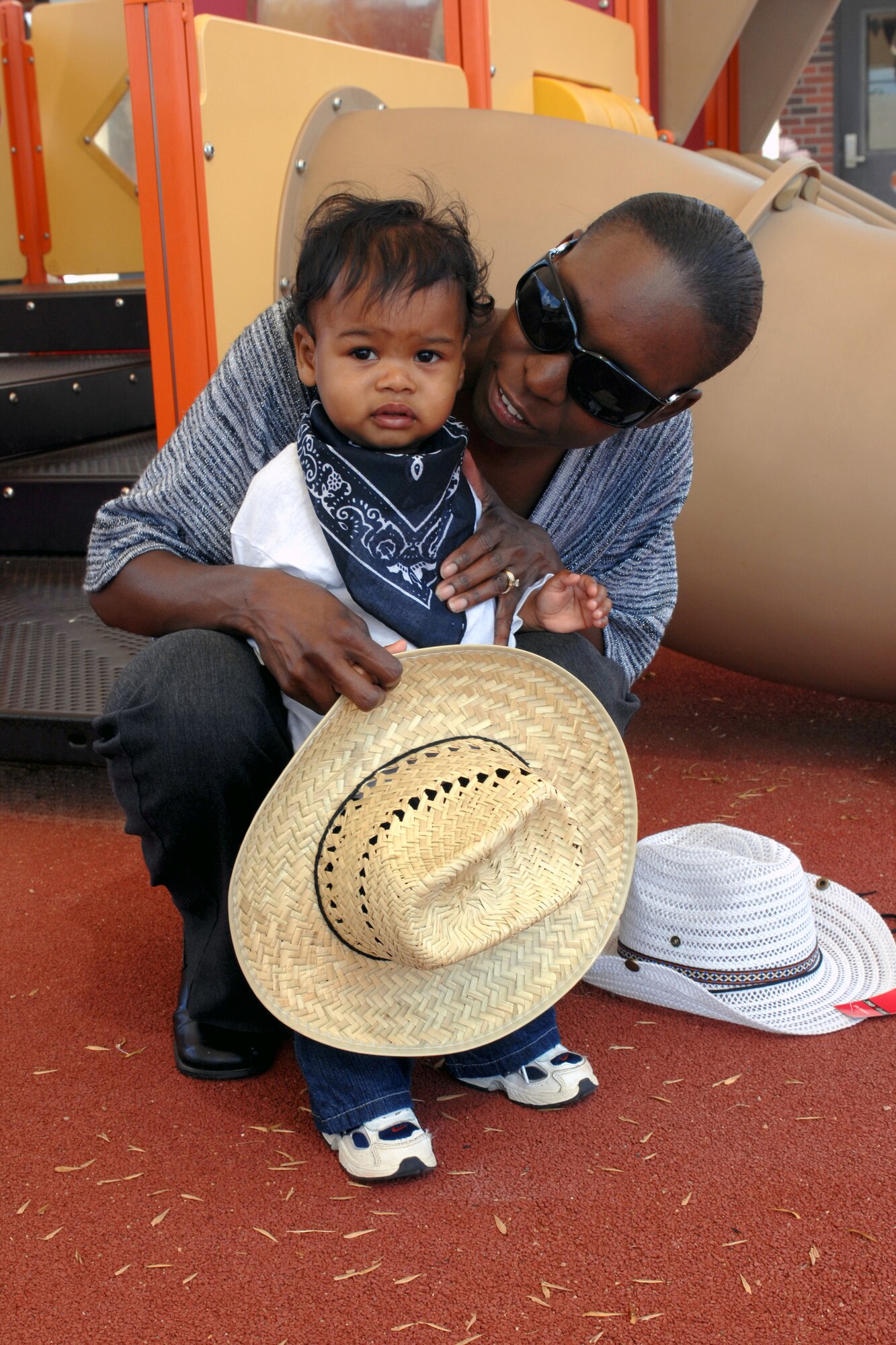 DYESS AIR FORCE BASE, Texas -- Arikibraa Andico and her son, Evin, enjoy the Child Development Center's Hoe Down which showcased a live band "Salt Kreek" for entertainment Sept. 28, 2007. (U.S. Air Force Photo By: SrA Domonique Simmons)