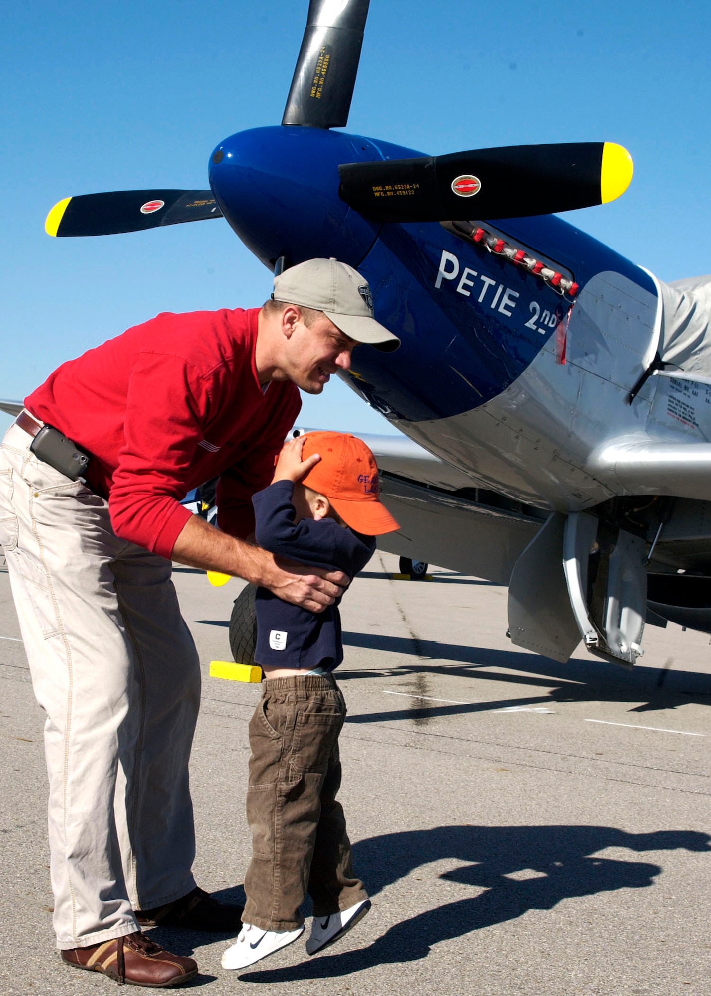 Zach and Marty Ertel from Columbus, Ohio, check out a P-51 at the Gathering of Mustangs and Legends held Sept. 28 at Rickenbacker International Airport in Ohio. This was Zach's first air show. (U.S. Air Force photo/Senior Airman Amanda Cain)
