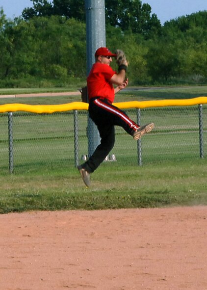 DYESS AIR FORCE BASE, Texas -- Master Sgt. Allen Oldfather, 7th Civil Engineer Squadron, catches a softball during intramurals Aug. 13. Sergeant Oldfather's involvement in sports earned him the title of Athlete of the Year for the base. He will go on to compete against other Air Combat Command athletes later this year. (Courtesy photo)