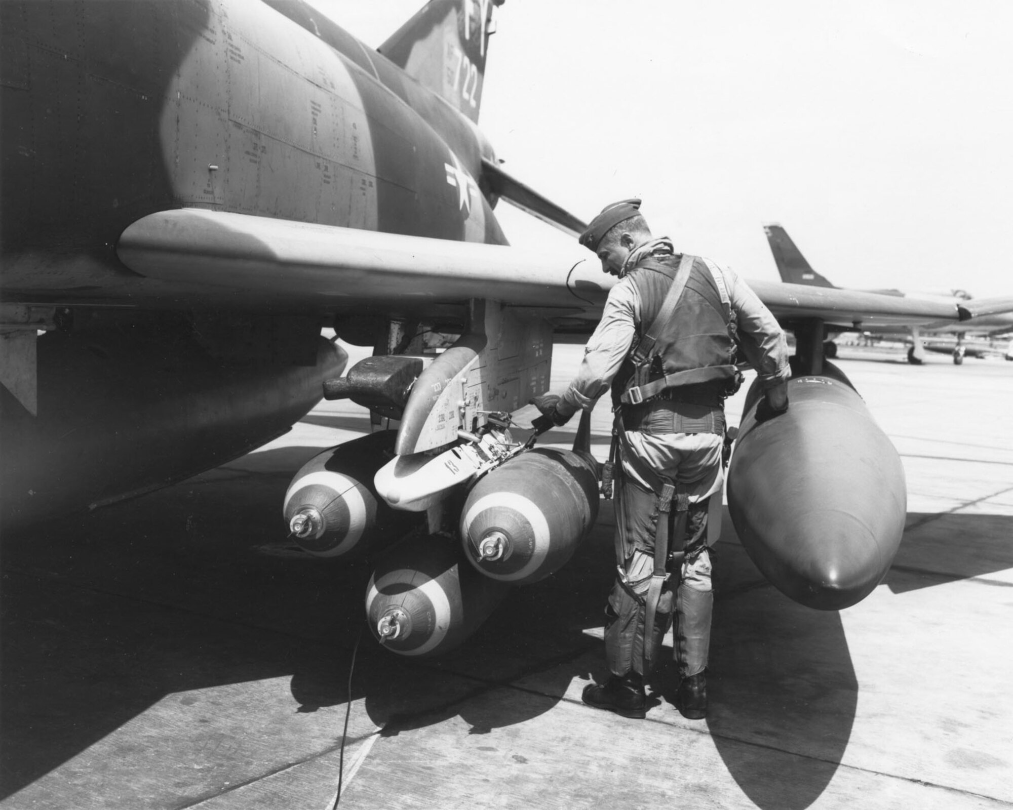 Col. Robin Olds checks his F-4 munitions prior to a mission. (U.S. Air Force photo)