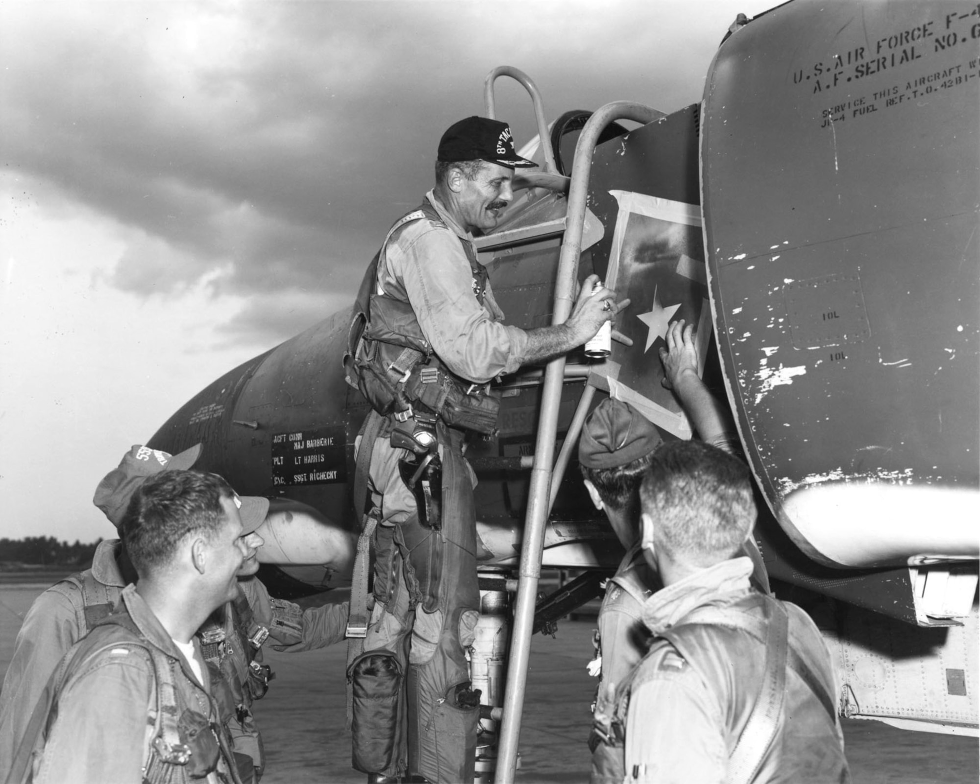 Col. Robin Olds painting a victory star on the F-4 he was flying on May 4, 1967, when he shot down a MiG-21. (U.S. Air Force photo)