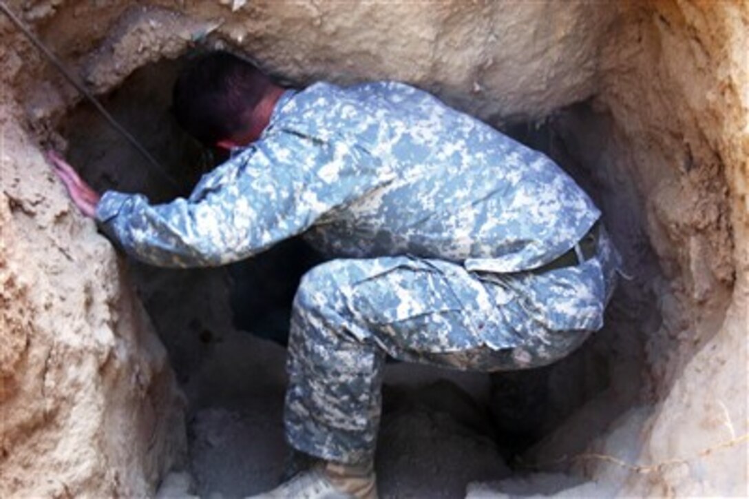 U.S. Army Staff Sgt. Jerry Bronson prepares to search a well for weapons in Sini, Afghanistan, on Sept. 23, 2007.  Bronson is assigned to 2nd Battalion, 508th Parachute Infantry Regiment.  
